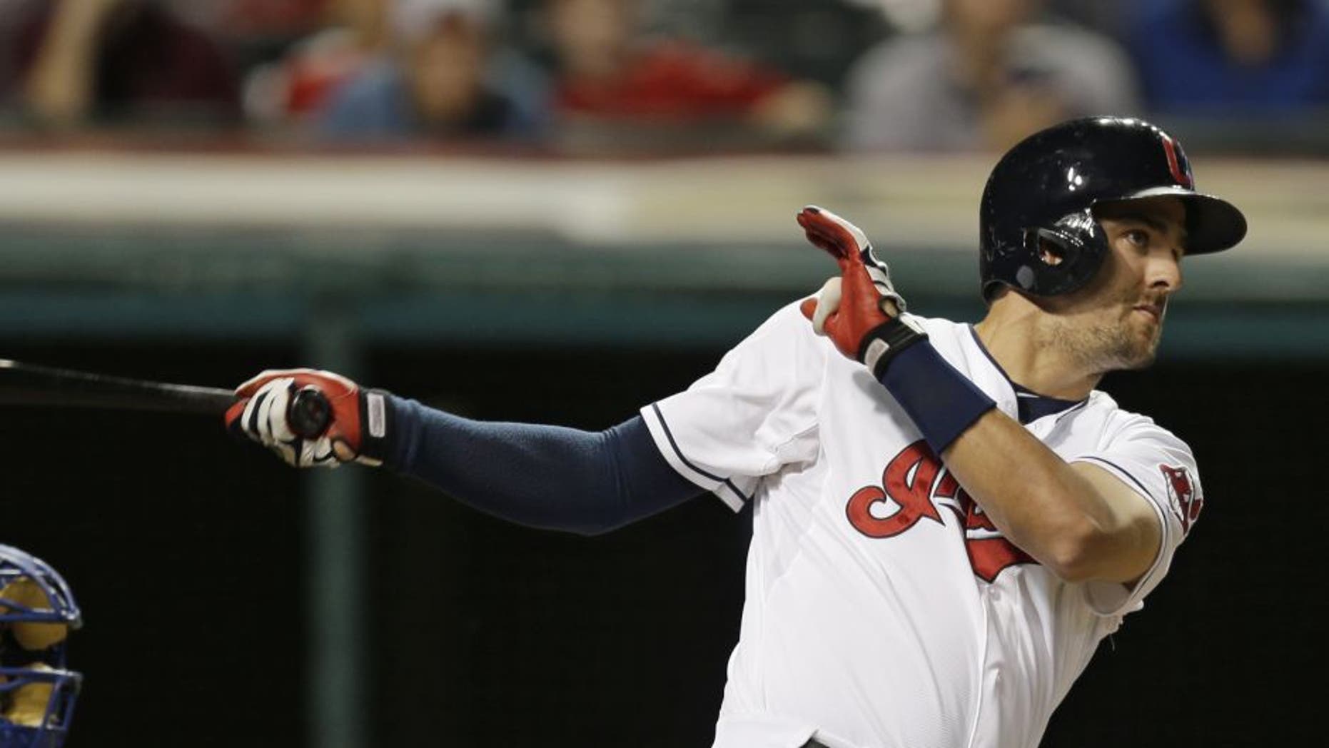 Cleveland Indians' Lonnie Chisenhall hits an RBI-double off Kansas City Royals starting pitcher Edinson Volquez on Monday night