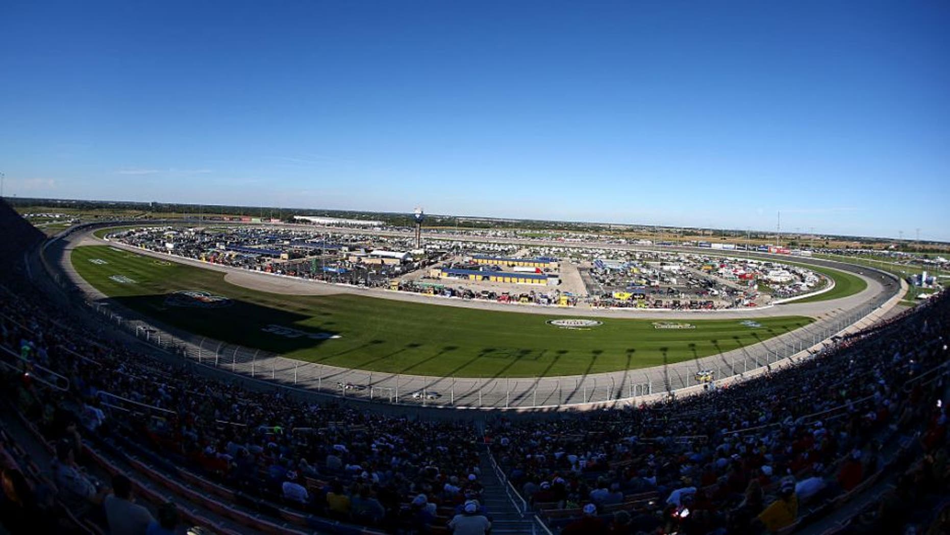 Race fans cheer during the NASCAR Sprint Cup Series myAFibRisk.com 400 at Chicagoland Speedway on September 20, 2015 in Joliet, Illinois.