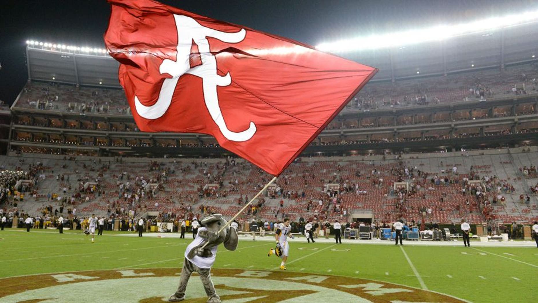 Sep 13, 2014; Tuscaloosa, AL, USA; Alabama Crimson Tide mascot Big Al waves the Alabama flag following their 52-12 victory against the Southern Miss Golden Eagles at Bryant-Denny Stadium. Mandatory Credit: John David Mercer-USA TODAY Sports