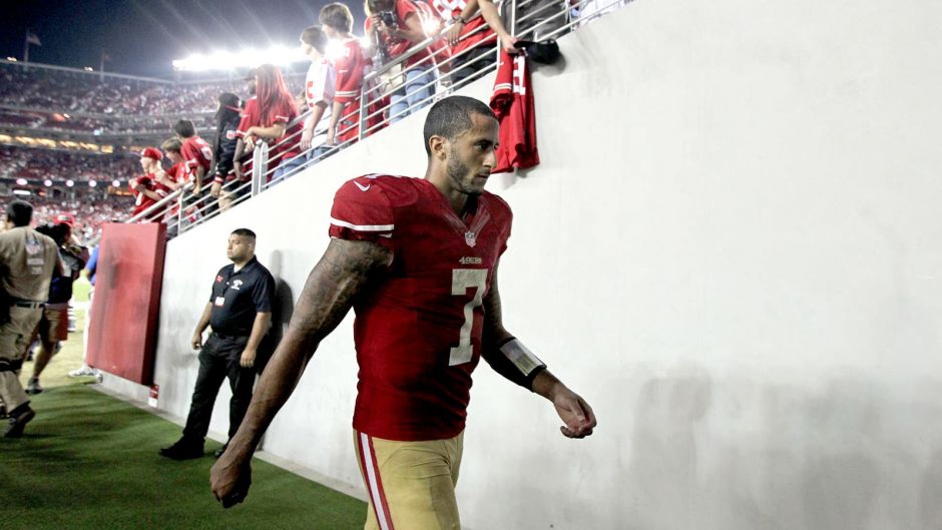 Sep 14, 2014; Santa Clara, CA, USA; San Francisco 49ers quarterback Colin Kaepernick (7) walks off the field after loosing to the Chicago Bears 28-20 at Levis Stadium. Mandatory Credit: Lance Iversen-USA TODAY Sports