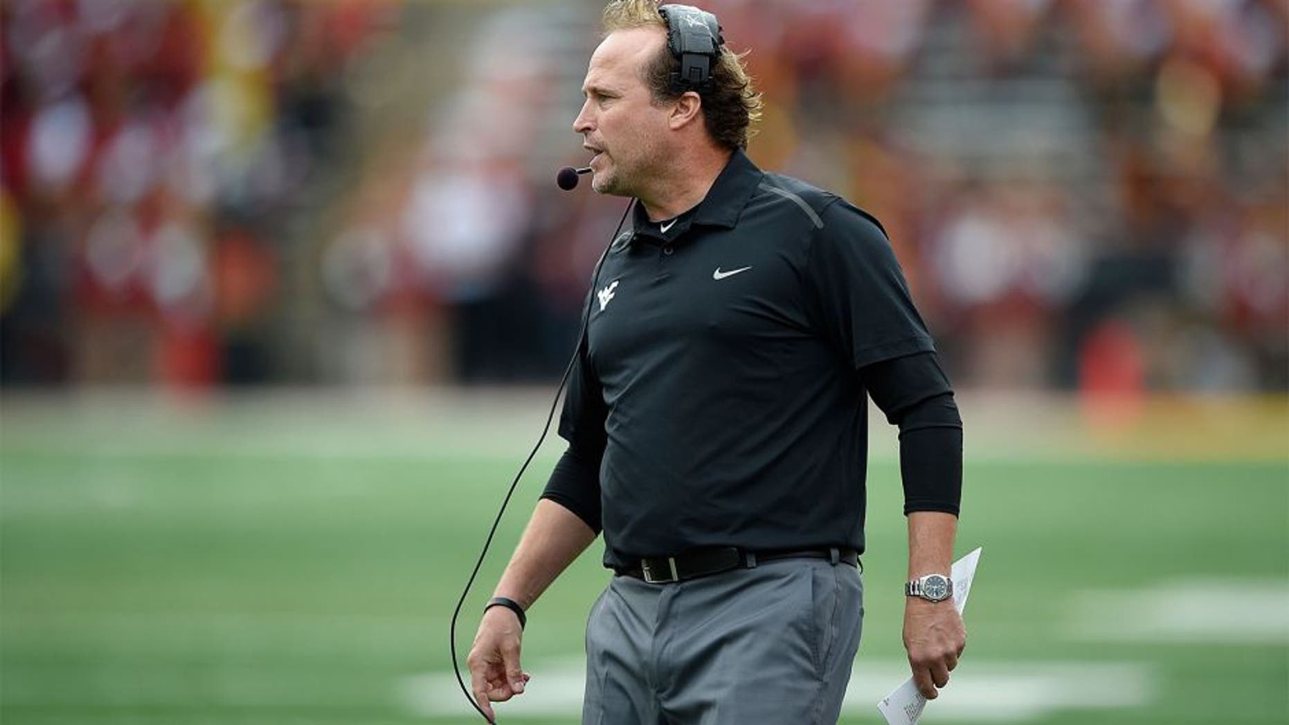 West Virginia head coach Dana Holgorsen looks on during the second half of an NCAA football game against Maryland, Saturday, Sept. 13, 2014, in College Park, Md. West Virginia won 40-37. (AP Photo/Nick Wass)