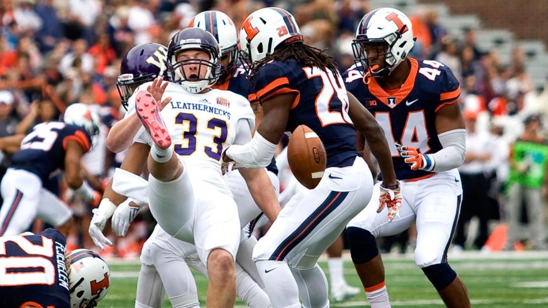 Sep 12, 2015; Champaign, IL, USA; Illinois Fighting Illini defensive back Jaylen Dunlap (28) blocks the punt from Western Illinois Leathernecks place kicker Nathan Knuffman (33) which was run back for a touchdown by Illinois Fighting Illini wide receiver Marchie Murdock (not pictured) at Memorial Stadium. Mandatory Credit: Mike Granse-USA TODAY Sports