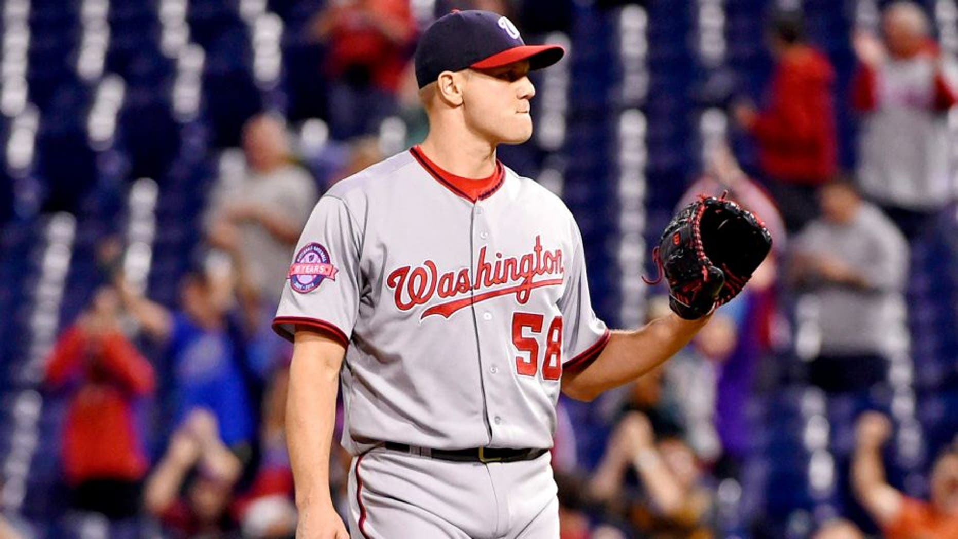 Sep 14, 2015; Philadelphia, PA, USA; Washington Nationals relief pitcher Jonathan Papelbon (58) waits for a new baseball after allowing a game-tying home run during the tenth inning against the Philadelphia Phillies at Citizens Bank Park. The Nationals defeated the Phillies, 8-7 in 11 innings. Mandatory Credit: Eric Hartline-USA TODAY Sports