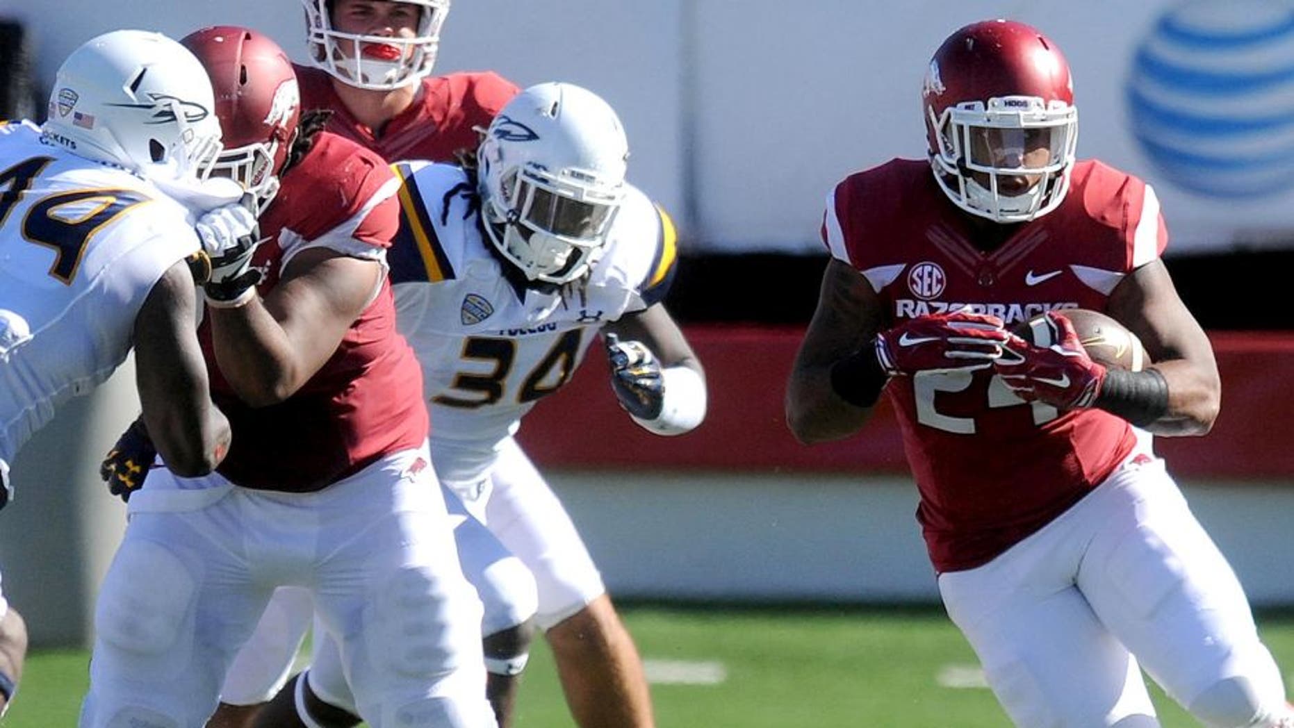 Sep 12, 2015; Little Rock, AR, USA; Arkansas Razorbacks running back Kody Walker (24) runs the ball against the Toledo Rockets during the second quarter at War Memorial Stadium. Mandatory Credit: Mark D. Smith-USA TODAY Sports