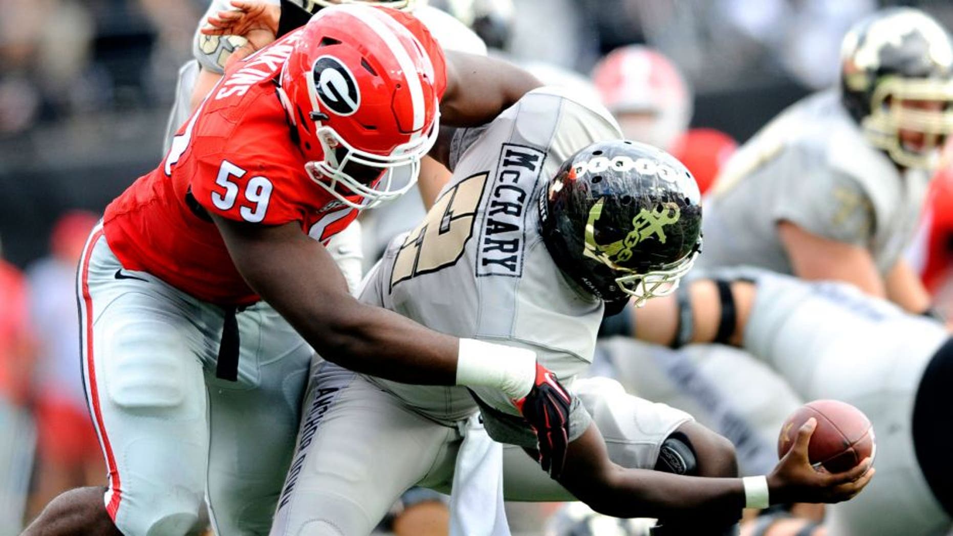 Sep 12, 2015; Nashville, TN, USA; Vanderbilt Commodores quarterback Johnny McCrary (2) is sacked by Georgia Bulldogs linebacker Jordan Jenkins (59) during the first half at Vanderbilt Stadium. Mandatory Credit: Christopher Hanewinckel-USA TODAY Sports
