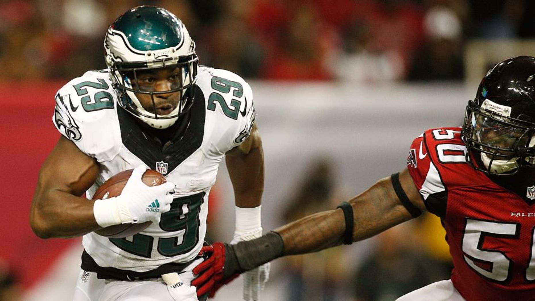 Sep 14, 2015; Atlanta, GA, USA; Philadelphia Eagles running back DeMarco Murray (29) carries the ball past Atlanta Falcons linebacker O'Brien Schofield (50) in the third quarter at the Georgia Dome. Mandatory Credit: Brett Davis-USA TODAY Sports