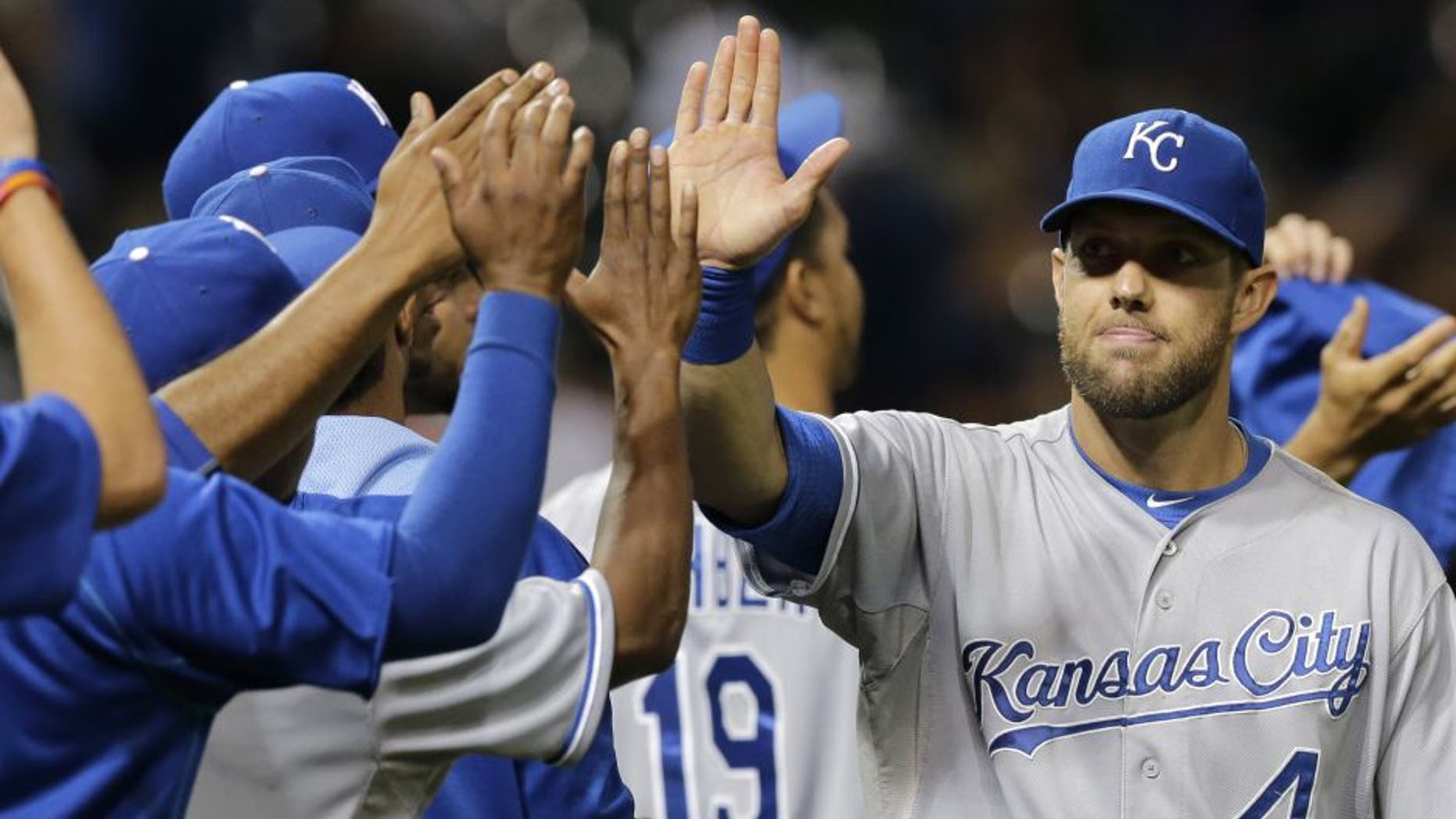 Kansas City Royals' Alex Gordon is congratulated after the Royals defeated the Cleveland Indians 2-0 on Tuesday night