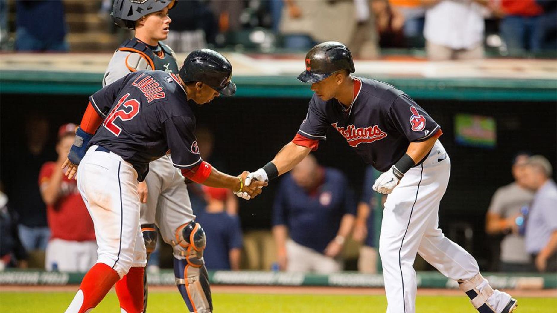 CLEVELAND, OH - SEPTEMBER 10: Francisco Lindor #12 of celebrates with Michael Brantley #23 of the Cleveland Indians after Brantley hit a two run home run during the eighth inning against the Detroit Tigers at Progressive Field on September 10, 2015 in Cleveland, Ohio. (Photo by Jason Miller/Getty Images)