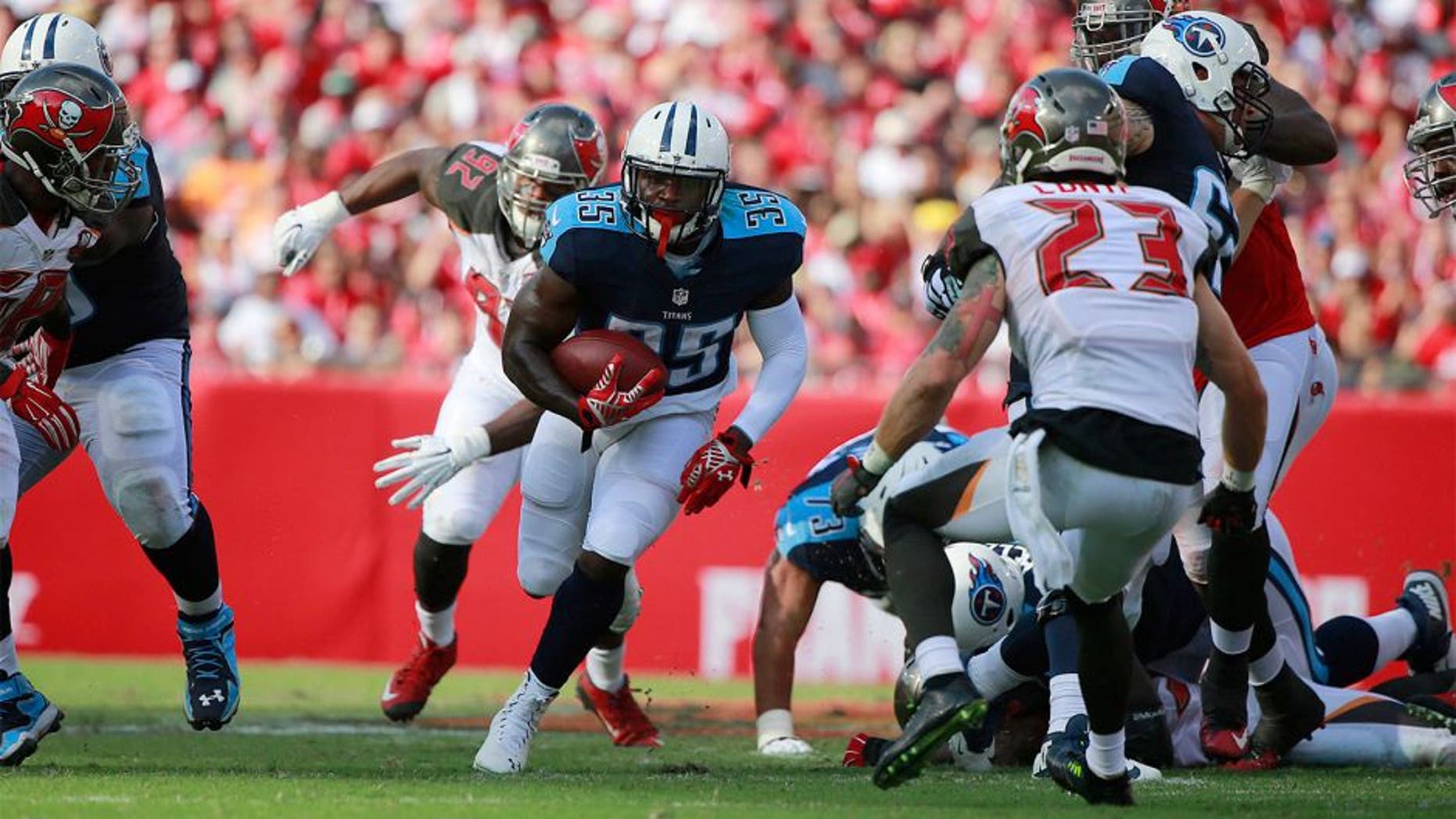 Sep 13, 2015; Tampa, FL, USA; Tennessee Titans running back Terrance West (35) runs with the ball against the Tampa Bay Buccaneers during the first half at Raymond James Stadium. Mandatory Credit: Kim Klement-USA TODAY Sports
