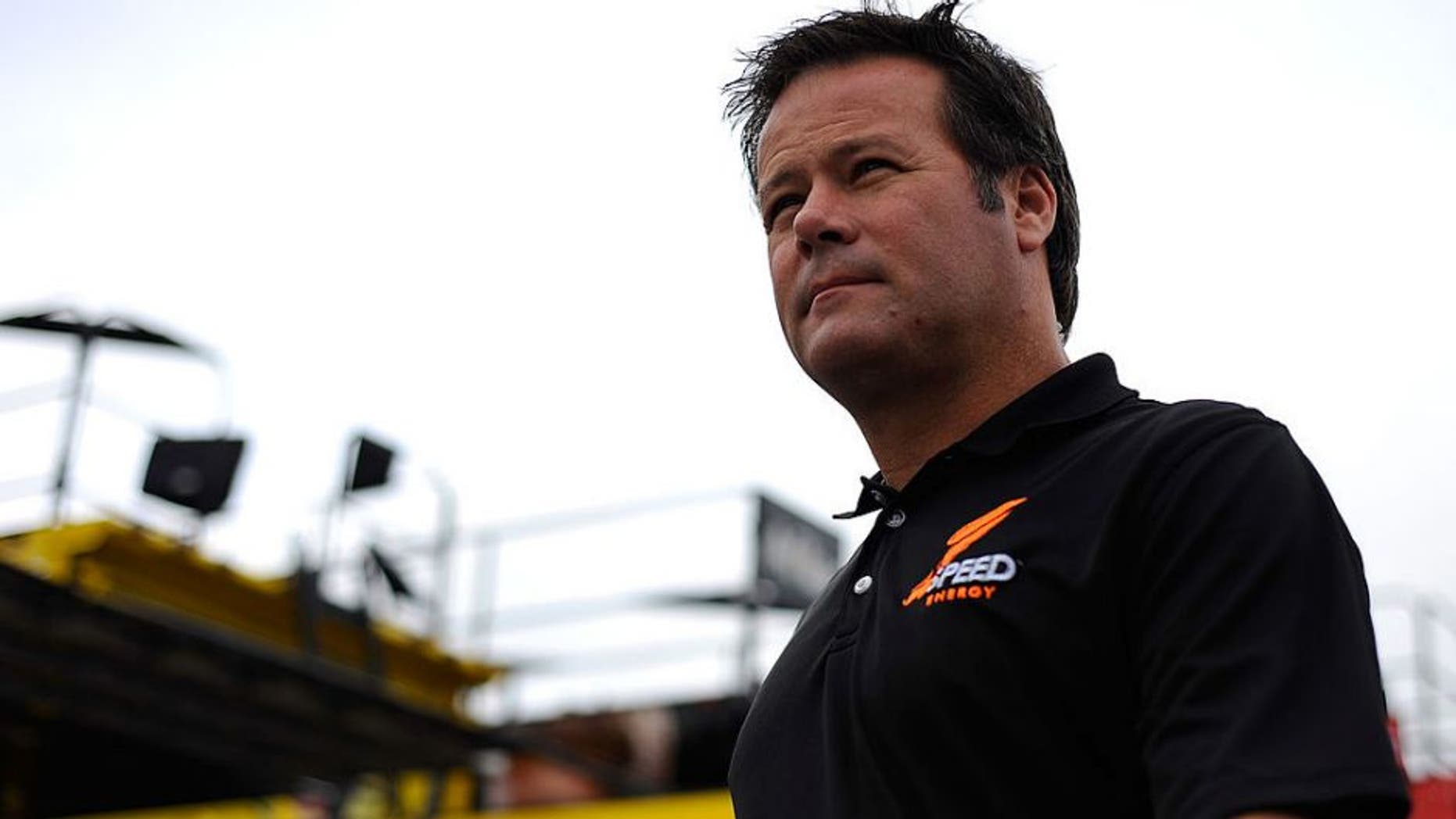 LOUDON, NH - SEPTEMBER 23: Robby Gordon, driver of the #7 Speed Energy Dodge, walks through the garage area during practice for the NASCAR Sprint Cup Series Sylvania 300 at New Hampshire Motor Speedway on September 23, 2011 in Loudon, New Hampshire. (Photo by Jason Smith/Getty Images for NASCAR)