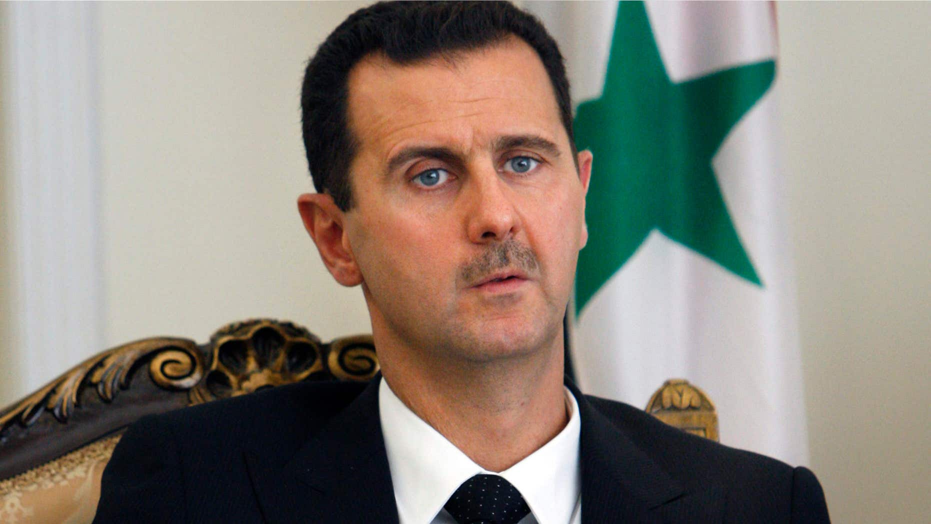Aug. 19, 2009: This file photo shows Syrian President Bashar Assad during a meeting with his Iranian counterpart Mahmoud Ahmadinejad in Tehran, Iran.