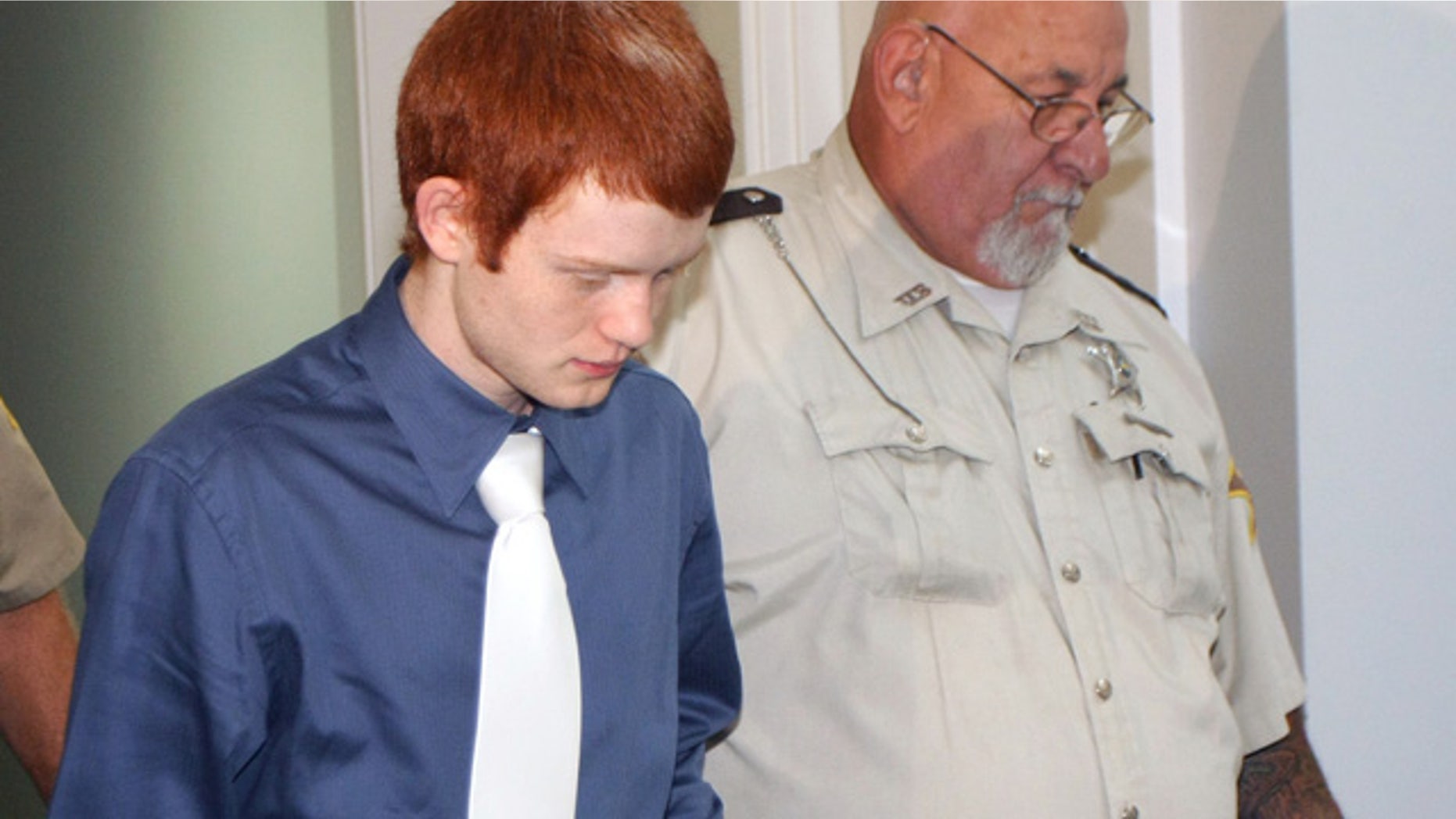 Sept. 15: Andrew Conley, left, is led into an Ohio County courtroom for his sentencing hearing in Rising Sun, Ind.