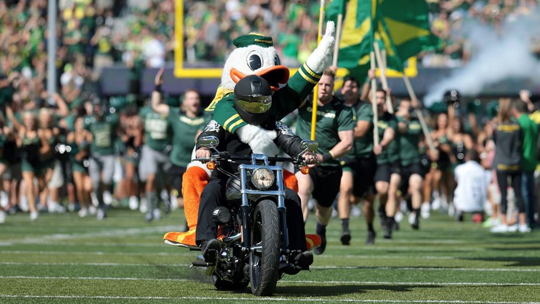 Sep 13, 2014; Eugene, OR, USA; Oregon Ducks mascot rides on the back of a motorcycle before the game Wyoming Cowboys at Autzen Stadium. Mandatory Credit: Scott Olmos-USA TODAY Sports