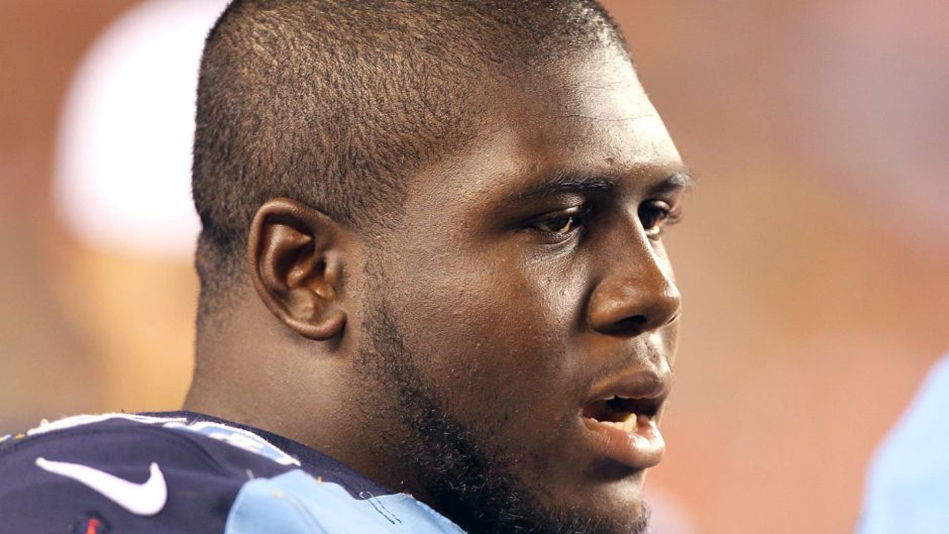 Aug 17, 2013; Cincinnati, OH, USA; Tennessee Titans offensive guard Chance Warmack (70) watches from the sidelines during a game against the Cincinnati Bengals at Paul Brown Stadium. Mandatory Credit: Brian Spurlock-USA TODAY Sports