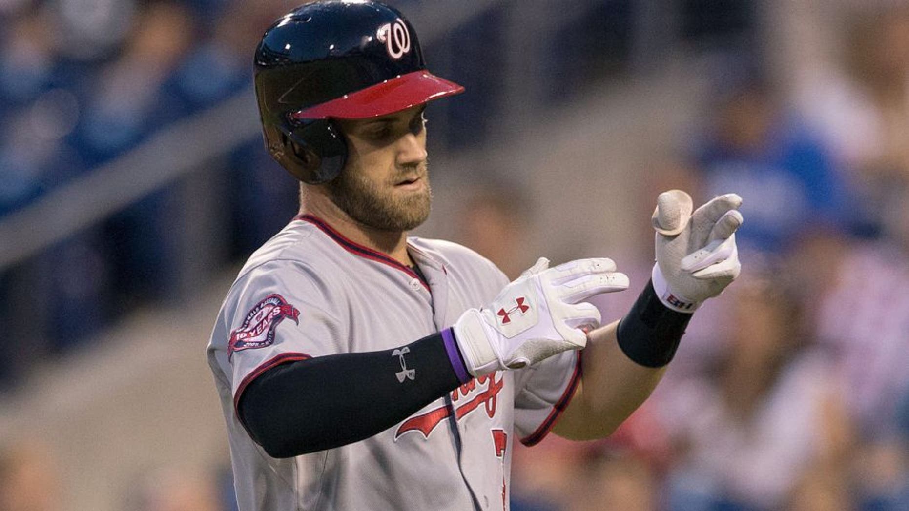 PHILADELPHIA, PA - SEPTEMBER 15: Bryce Harper #34 of the Washington Nationals reacts after hitting a solo home run in the top of the first inning against the Philadelphia Phillies on September 15, 2015 at Citizens Bank Park in Philadelphia, Pennsylvania. The Nationals defeated the Phillies 4-0. (Photo by Mitchell Leff/Getty Images)
