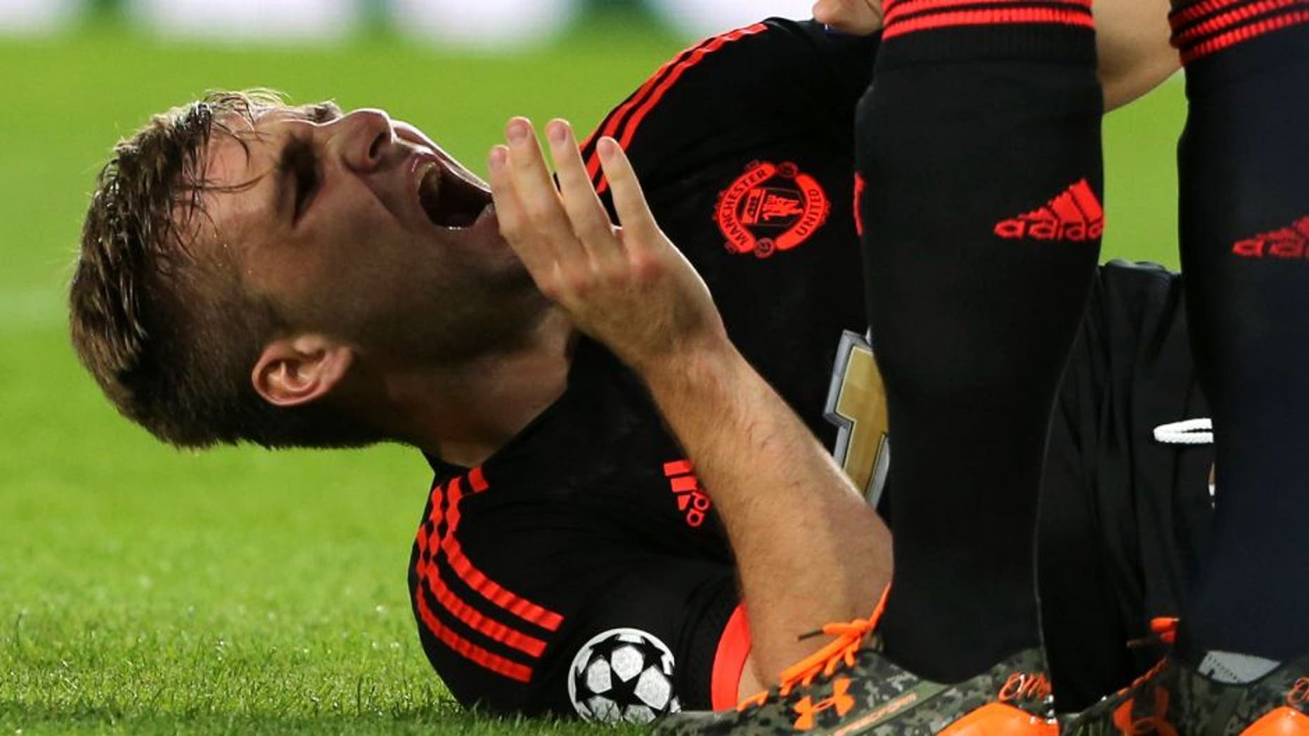 EINDHOVEN, NETHERLANDS - SEPTEMBER 15: Luke Shaw of Manchester United receives treatment on a leg injury during the UEFA Champions League match between PSV Eindhoven and Manchester United at Philips Stadion on September 15, 2015 in Eindhoven, Netherlands. (Photo by John Peters/Man Utd via Getty Images)