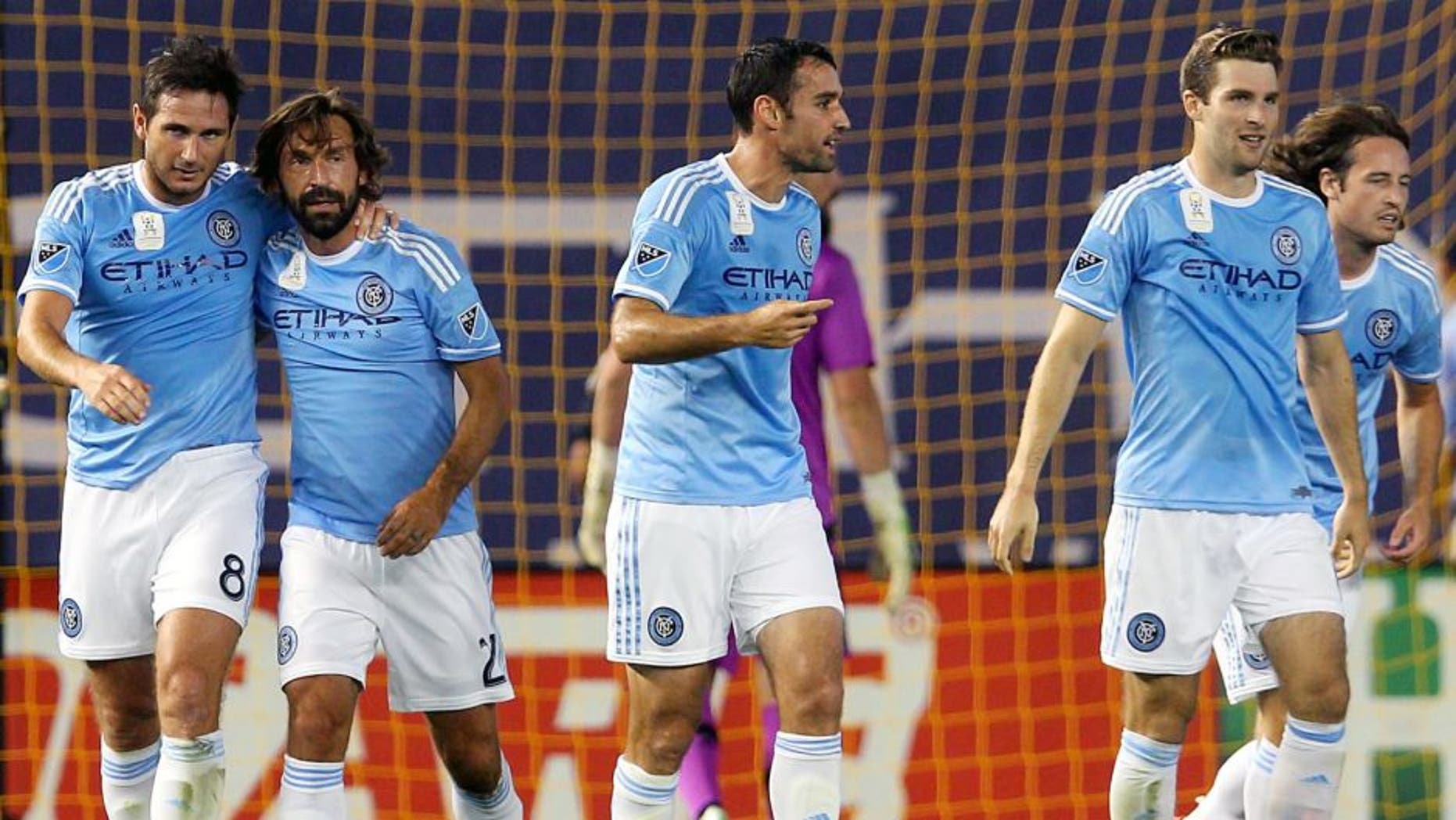 Sep 16, 2015; New York, NY, USA; New York City FC midfielder Frank Lampard (8) and New York City FC midfielder Andrea Pirlo (21) celebrate Lampard's goal against Toronto FC during the first half at Yankee Stadium. Mandatory Credit: Brad Penner-USA TODAY Sports
