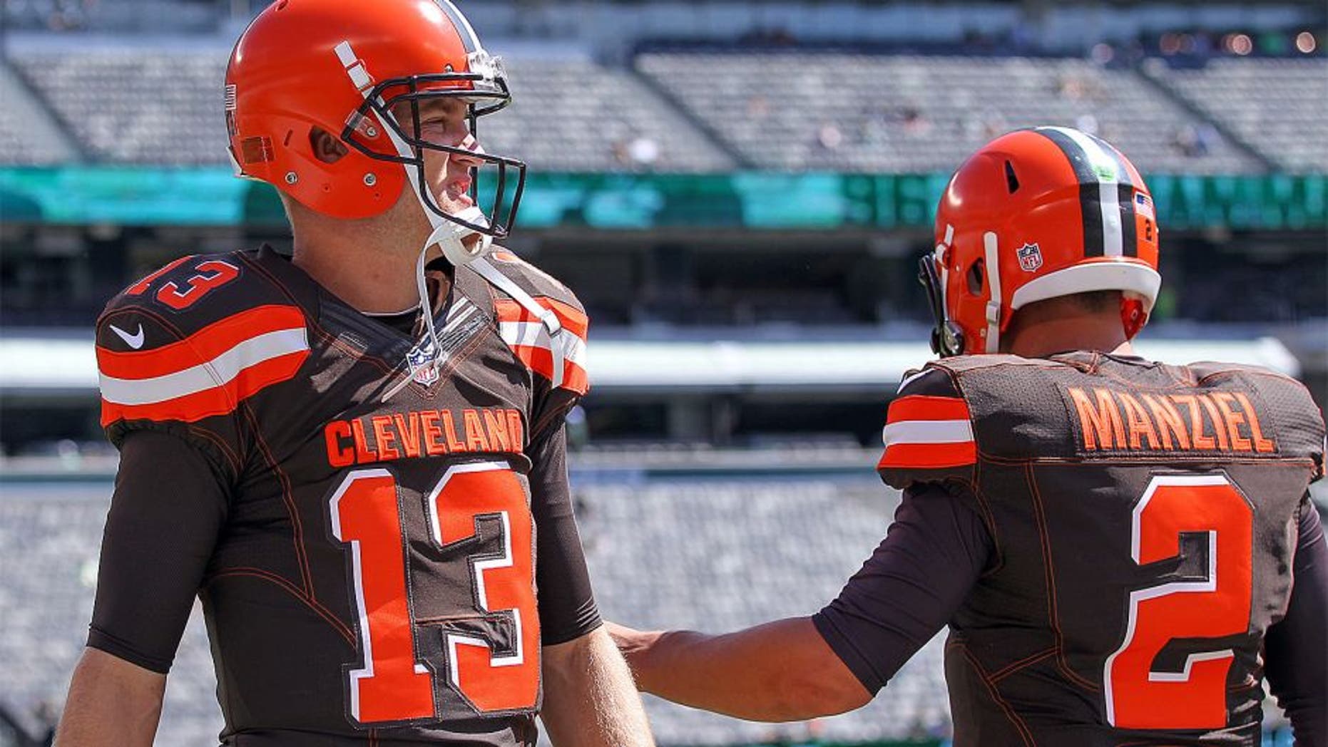 Sep 13, 2015; East Rutherford, NJ, USA; Cleveland Browns quarterback Johnny Manziel (2) and Cleveland Browns quarterback Josh McCown (13) during the pre game warmups for their game against the New York Jets at MetLife Stadium. Mandatory Credit: Ed Mulholland-USA TODAY Sports