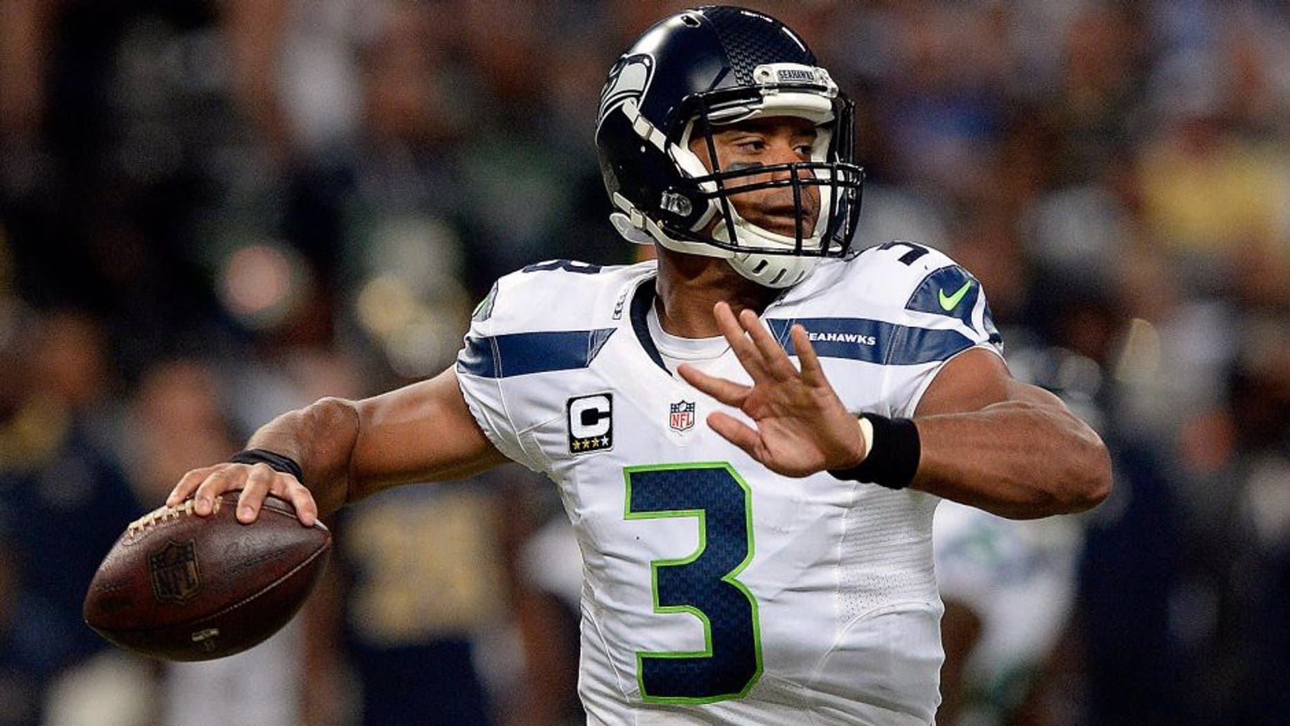 Sep 13, 2015; St. Louis, MO, USA; Seattle Seahawks quarterback Russell Wilson (3) passes against the St. Louis Rams during the first half at the Edward Jones Dome. Mandatory Credit: Jeff Curry-USA TODAY Sports