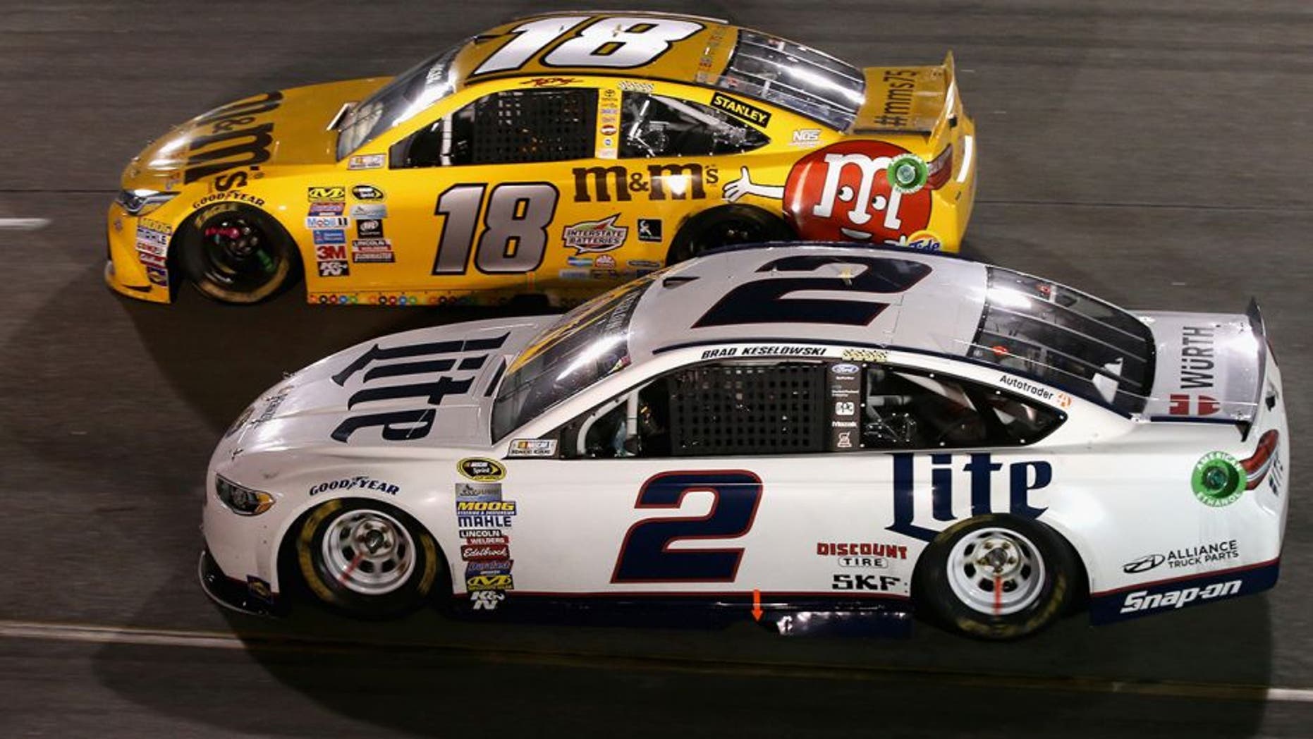 RICHMOND, VA - SEPTEMBER 10: Kyle Busch, driver of the #18 M&M's 75th Anniversary Toyota, races Brad Keselowski, driver of the #2 Miller Lite Ford, during the NASCAR Sprint Cup Series Federated Auto Parts 400 at Richmond International Raceway on September 10, 2016 in Richmond, Virginia. (Photo by Sean Gardner/Getty Images)
