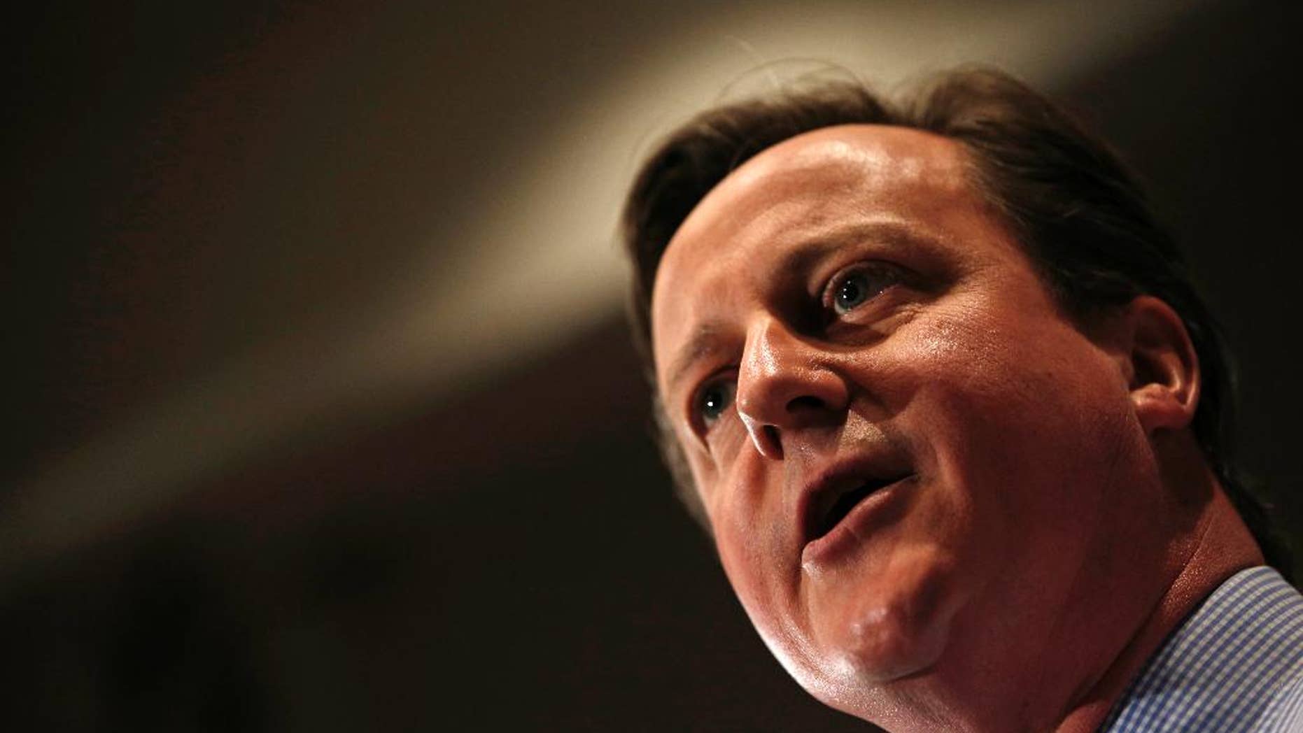 Britain's Prime Minister and leader of the Conservative Party, David Cameron, gives a speech during his general election campaign visit at the Institute of Chartered Accountants in London on Monday April 27, 2015. Britain goes to the polls on May 7 to elect a new parliament. (Adrian Dennis/Pool Photo via AP)