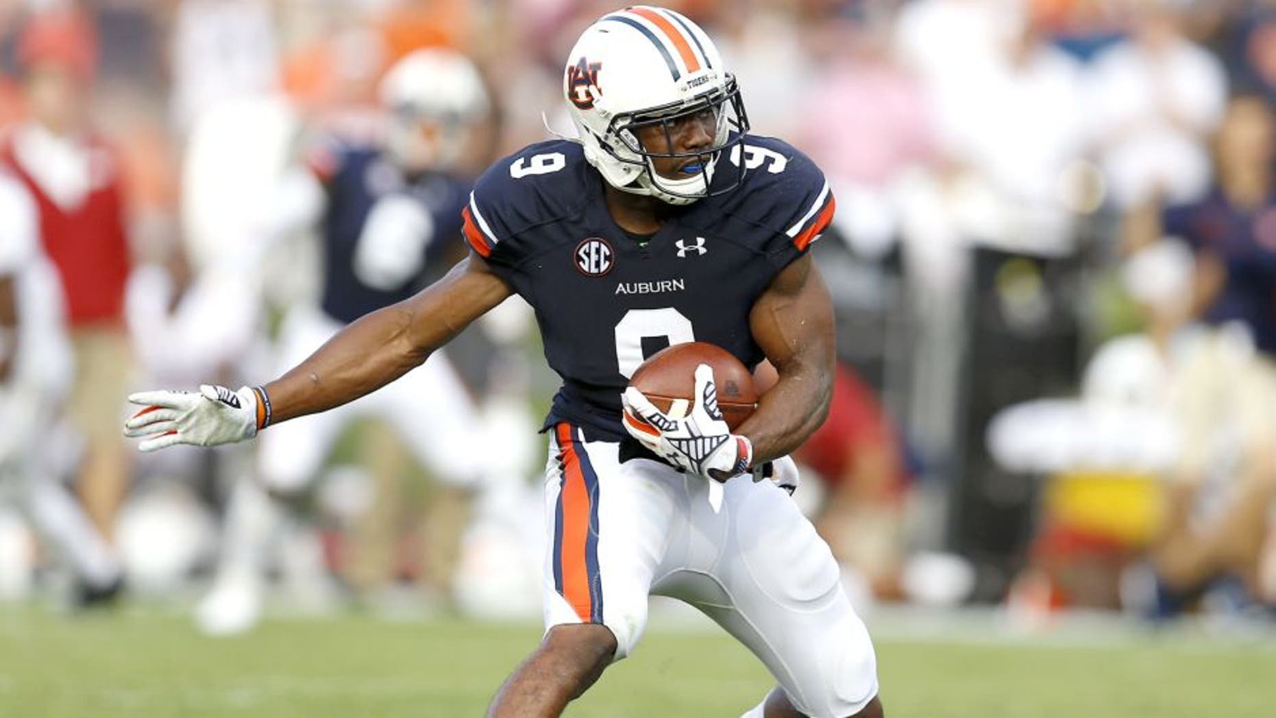 AUBURN, AL - AUGUST 30: Defensive back Jermaine Whitehead #9 of the Auburn Tigers intercepts a pass during the game against the Arkansas Razorbacks at Jordan Hare Stadium on August 30, 2014 in Auburn, Alabama. (Photo by Mike Zarrilli/Getty Images)