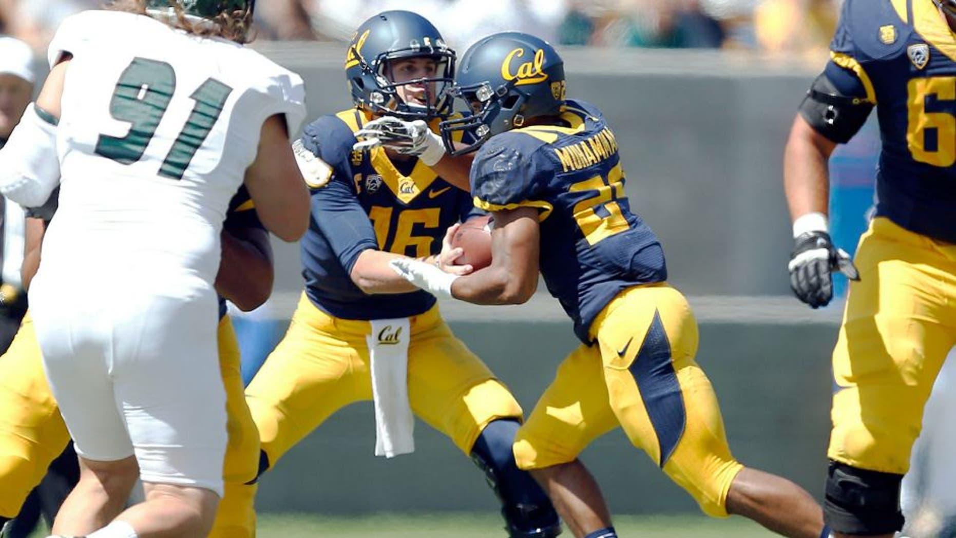 Sep 6, 2014; Berkeley, CA, USA; California Golden Bears quarterback Jared Goff (16) hands off to Golden Bears running back Khalfani Muhammad (29) during the first quarter against the Sacramento State Hornets at Memorial Stadium. Mandatory Credit: Bob Stanton-USA TODAY Sports