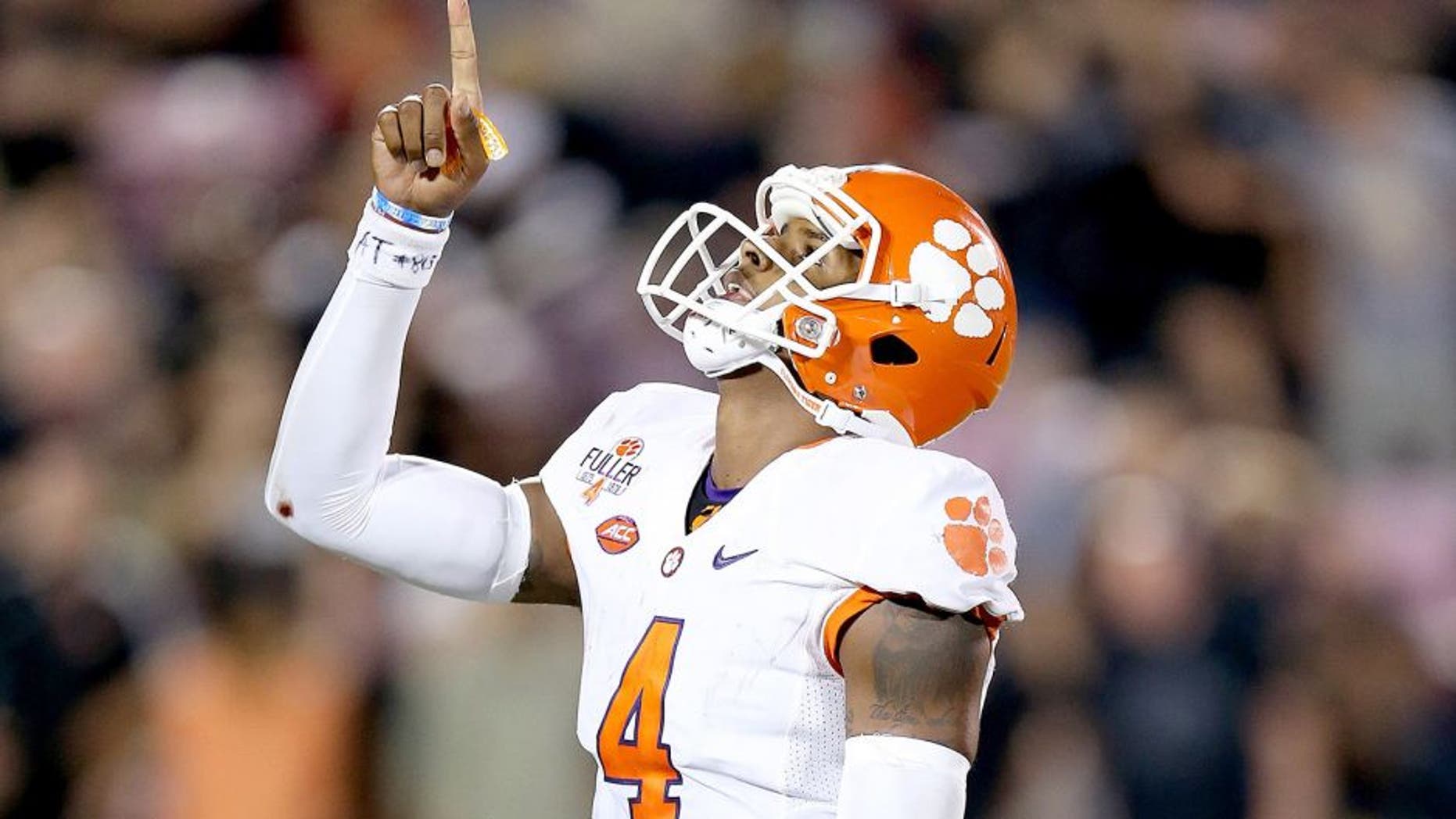 LOUISVILLE, KY - SEPTEMBER 17: Deshaun Watson #4 of the Clemson Tigers celebrates late in the fourth quarter of the 20-17 win over the Louisville Cardinals at Papa John's Cardinal Stadium on September 17, 2015 in Louisville, Kentucky. (Photo by Andy Lyons/Getty Images)