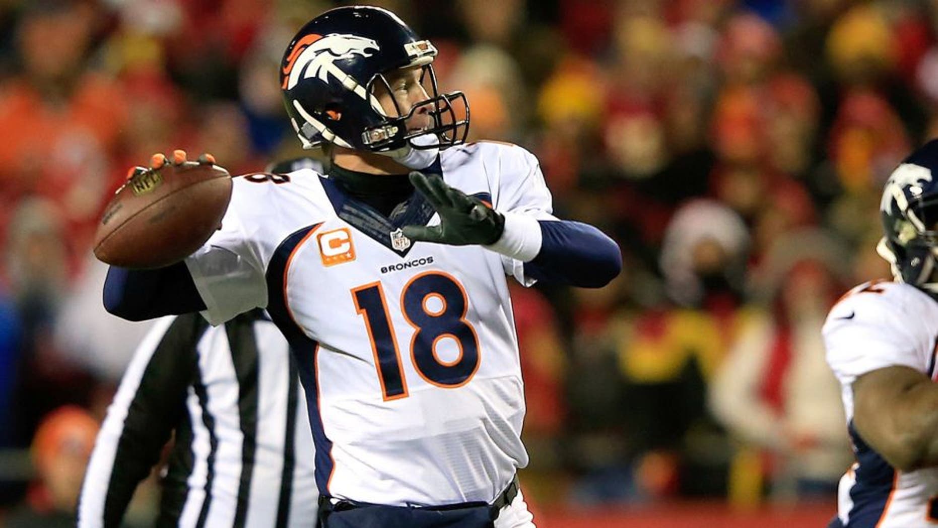 KANSAS CITY, MO - NOVEMBER 30: Peyton Manning #18 of the Denver Broncos passes against the Kansas City Chiefs during the first quarter at Arrowhead Stadium on November 30, 2014 in Kansas City, Missouri. (Photo by Jamie Squire/Getty Images)
