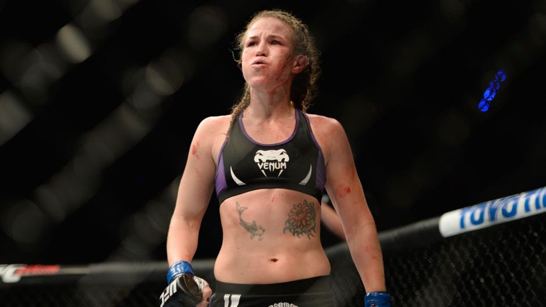 MEXICO CITY, MEXICO - NOVEMBER 15: Leslie Smith walks to her corner after her fight against Jessic Eye was called due to her ear being damaged in their women's bantamweight bout during the UFC 180 event at Arena Ciudad de Mexico on November 15, 2014 in Mexico City, Mexico. (Photo by Jeff Bottari/Zuffa LLC/Zuffa LLC via Getty Images)