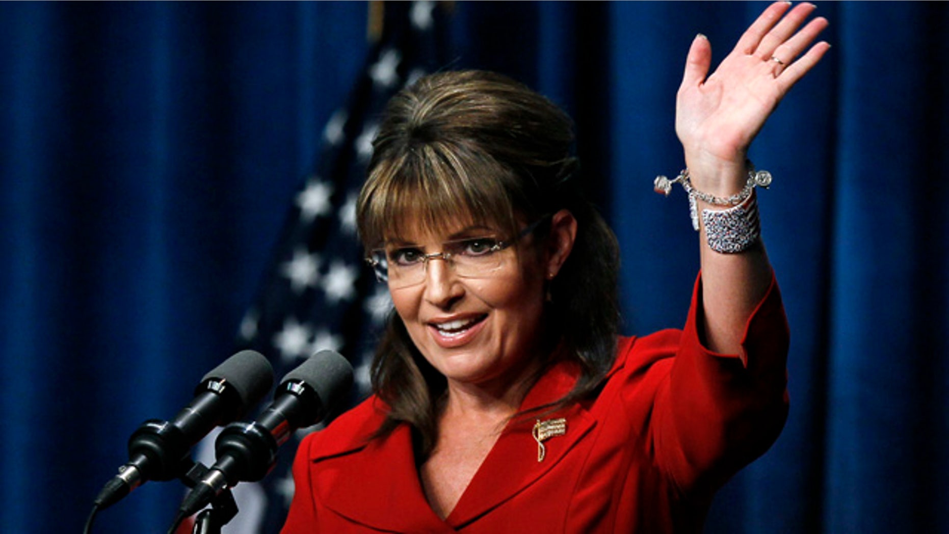 Sept. 17: Former Alaska Gov. Sarah Palin waves after speaking at the Republican Party of Iowa's Ronald Reagan Dinner in Des Moines, Iowa.