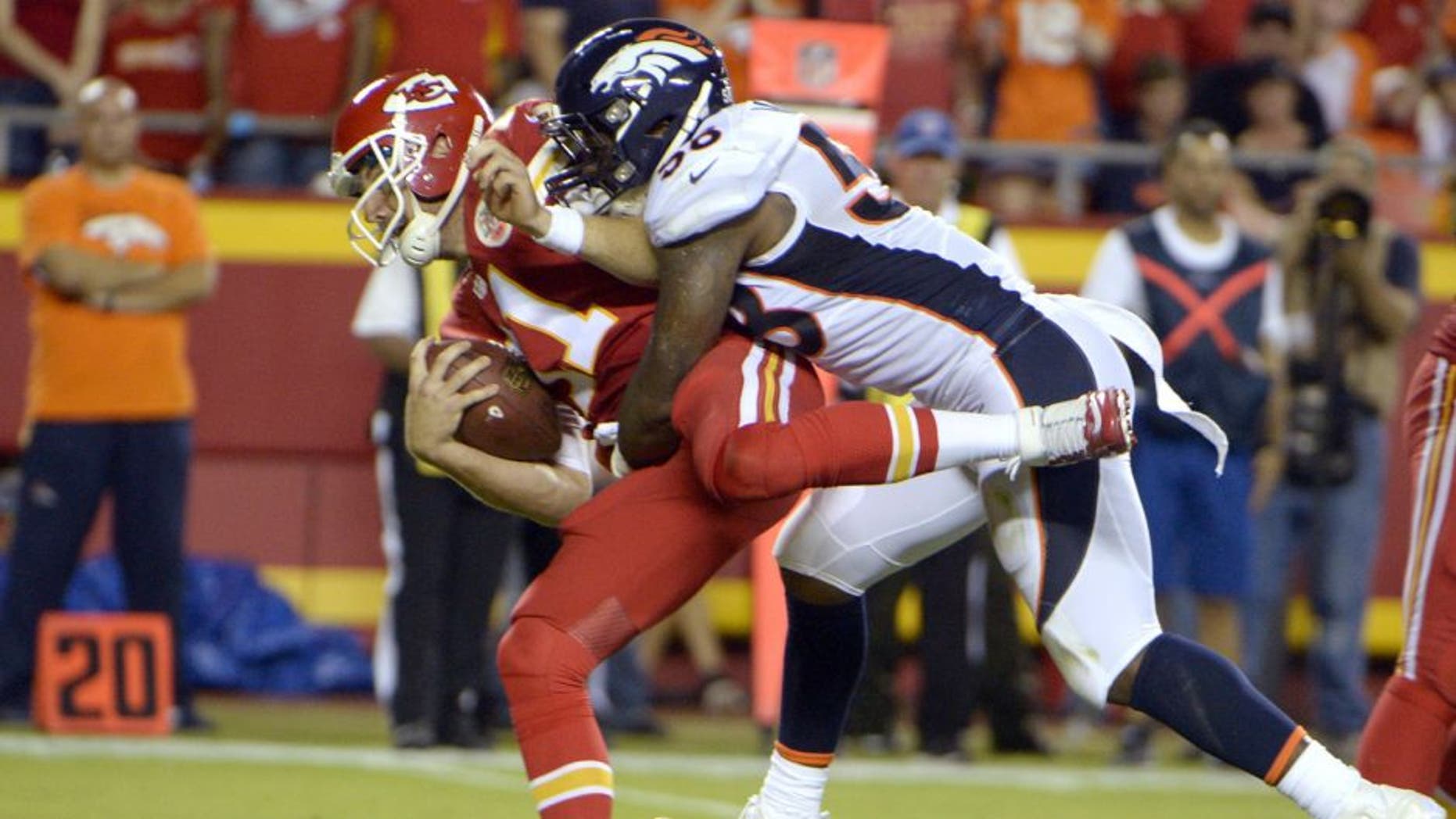 Sep 17, 2015; Kansas City, MO, USA; Denver Broncos outside linebacker Von Miller (58) is penalized for hitting Kansas City Chiefs quarterback Alex Smith (11) in the first half at Arrowhead Stadium. Mandatory Credit: John Rieger-USA TODAY Sports