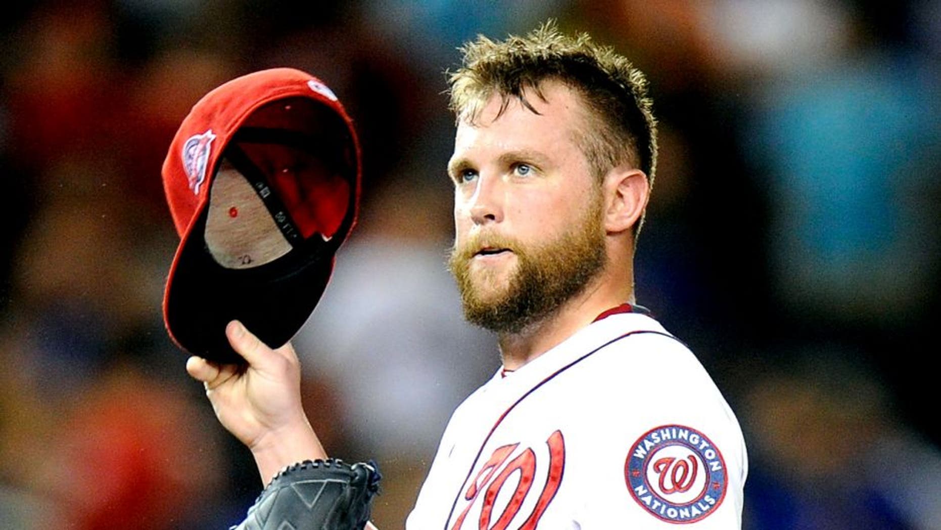 WASHINGTON, DC - SEPTEMBER 08: Drew Storen #22 of the Washington Nationals reacts after walking in a run in the seventh inning against the New York Mets at Nationals Park on September 8, 2015 in Washington, DC. New York won the game 8-7. (Photo by Greg Fiume/Getty Images)