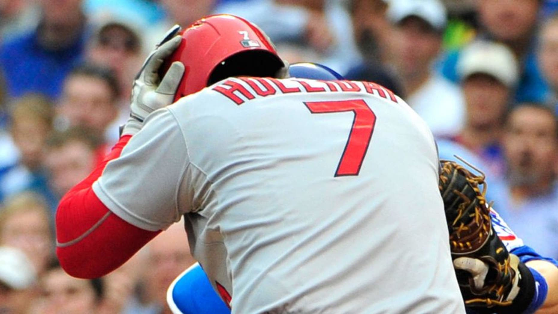 CHICAGO, IL - SEPTEMBER 18: Matt Holliday #7 of the St. Louis Cardinals holds his head after being hit by a pitch against the Chicago Cubs during the fifth inning on September 18, 2015 at Wrigley Field in Chicago, Illinois. (Photo by David Banks/Getty Images)
