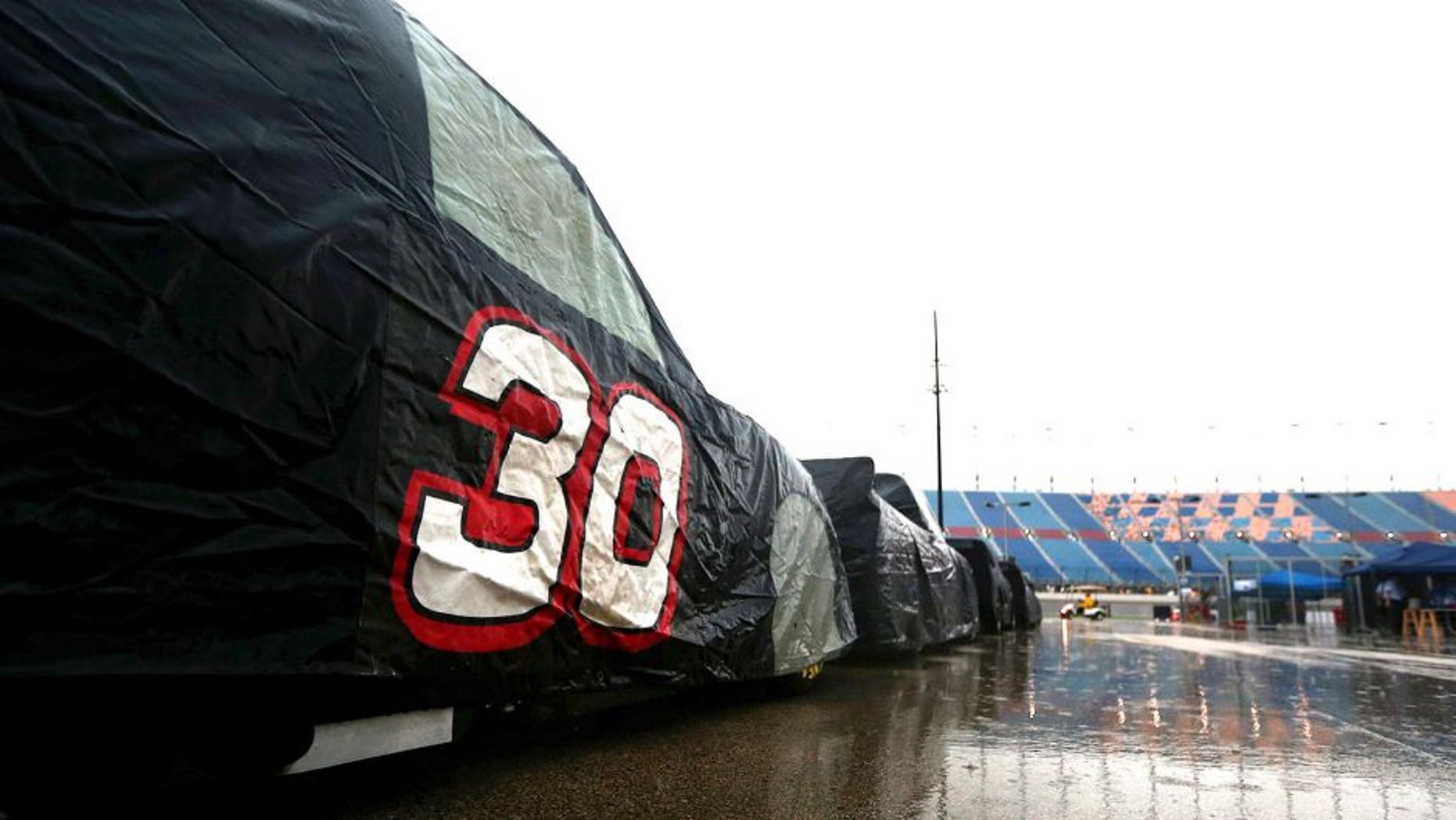 JOLIET, IL - SEPTEMBER 18: A view of pit road during heavy rain during qualifying for the NASCAR Camping World Truck Series American Ethanol E15 225 at Chicagoland Speedway on September 18, 2015 in Joliet, Illinois. (Photo by Sarah Crabill/NASCAR via Getty Images)
