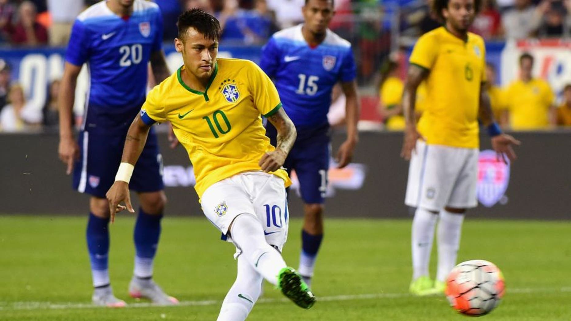 FOXBORO, MA - SEPTEMBER 08: Neymar #10 of Brazil scores a penalty kick goal during an international friendly against the United States at Gillette Stadium on September 8, 2015 in Foxboro, Massachusetts. (Photo by Billie Weiss/Getty Images)