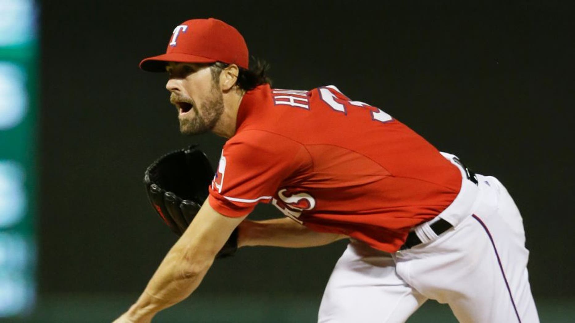 Texas Rangers starter Cole Hamels reacts after releasing a pitch during the seventh inning of a baseball game against the Texas Rangers in Arlington, Texas, Saturday, Sept. 19, 2015. The Rangers won 10-1. (AP Photo/LM Otero)