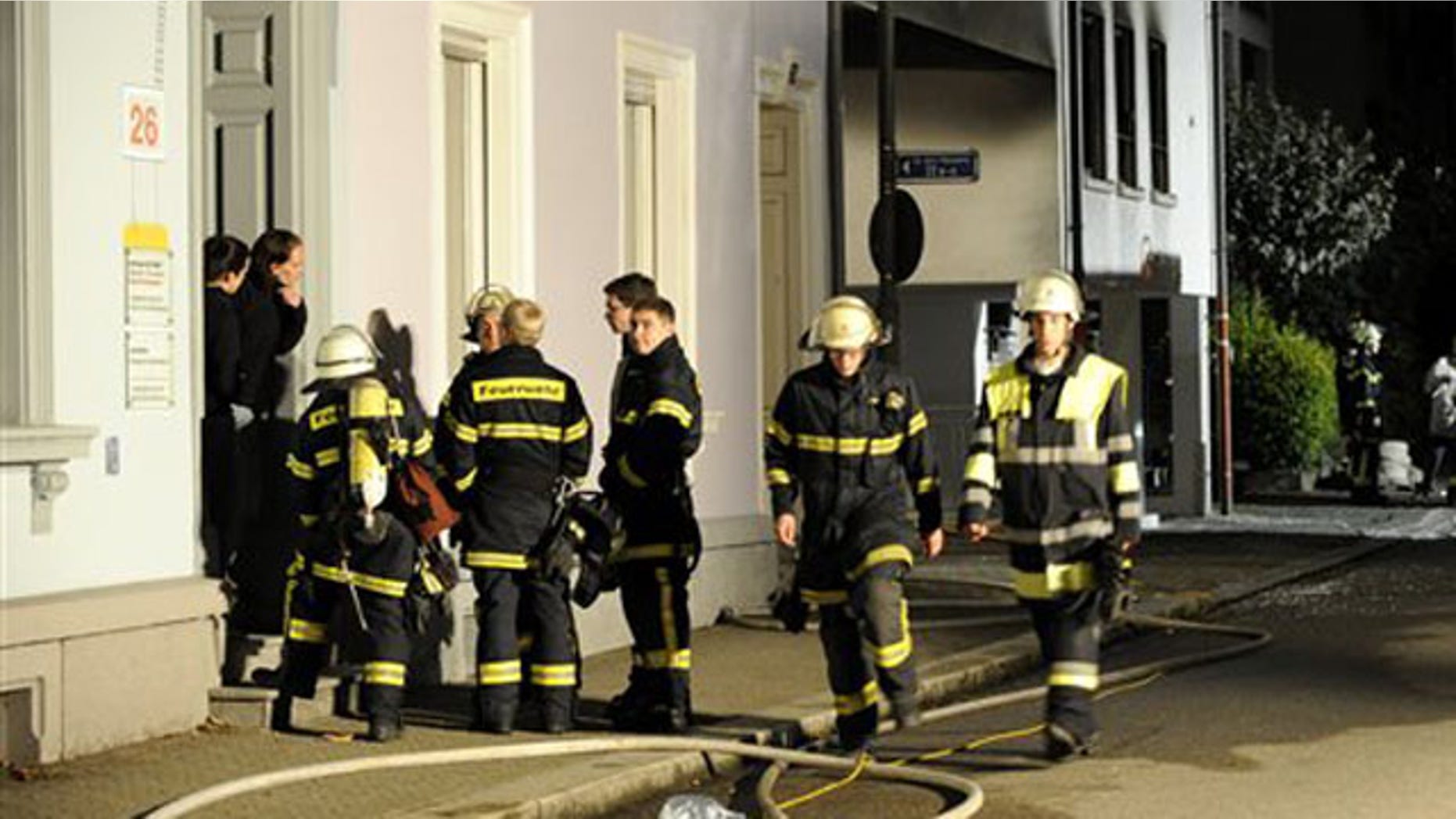 Sept. 19: Firefighters stand in front of a house where an explosion occured in Loerrach, southern Germany.