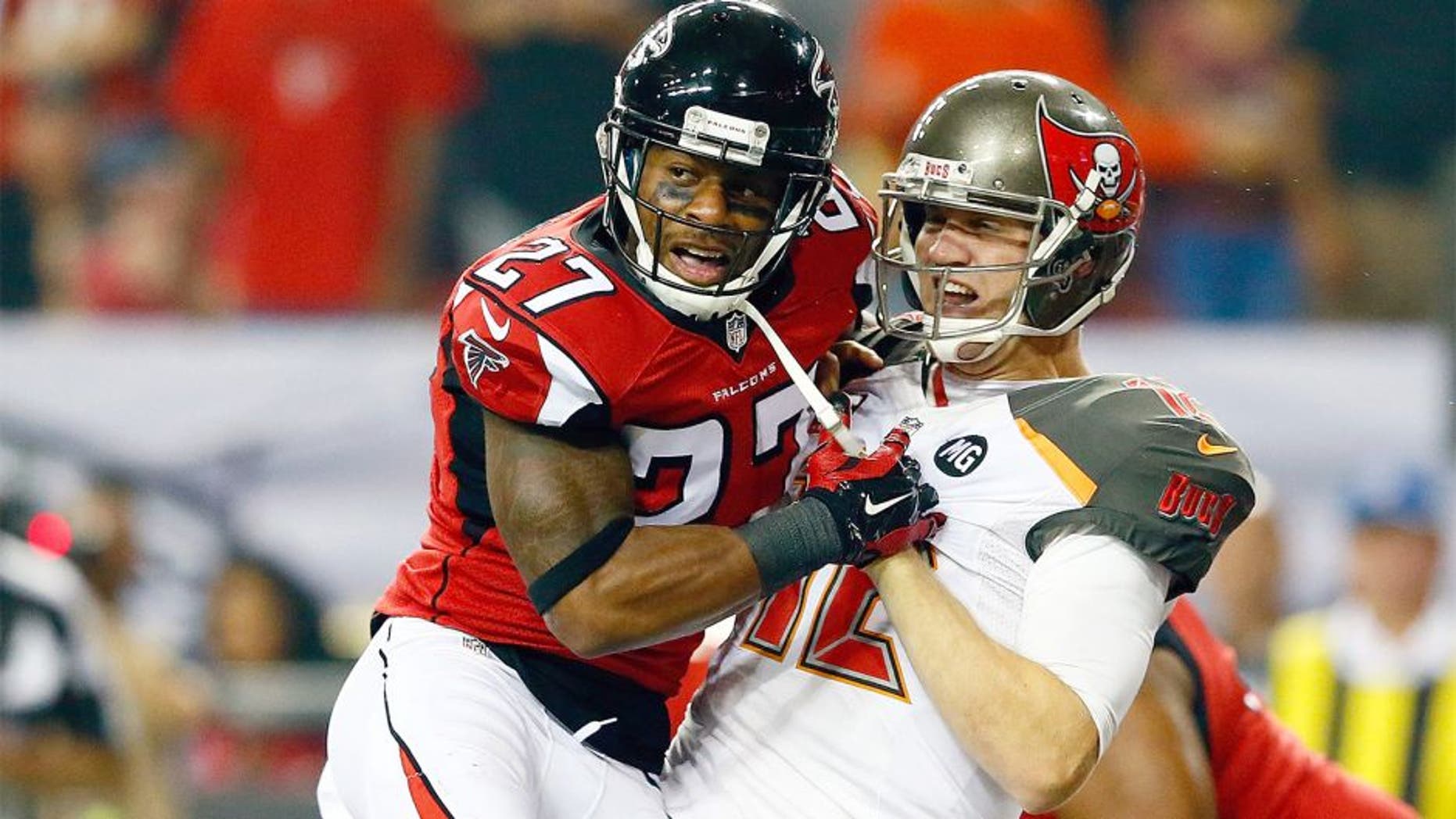 ATLANTA, GA - SEPTEMBER 18: Quarterback Josh McCown #12 of the Tampa Bay Buccaneers under pressure from cornerback Robert McClain #27 of the Atlanta Falcons after injuring his hand during a game at the Georgia Dome on September 18, 2014 in Atlanta, Georgia. (Photo by Kevin C. Cox/Getty Images)