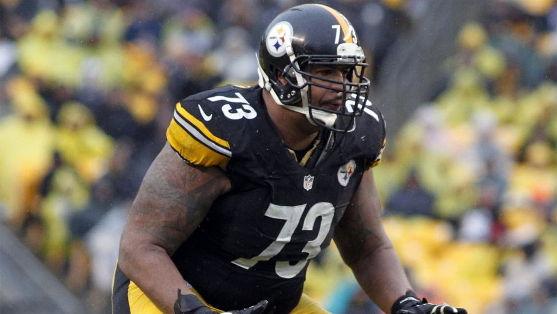 Dec 29, 2013; Pittsburgh, PA, USA; Pittsburgh Steelers guard Ramon Foster (73) blocks at the line of scrimmage against the Cleveland Browns during the fourth quarter at Heinz Field. The Steelers won 20-7. Mandatory Credit: Charles LeClaire-USA TODAY Sports