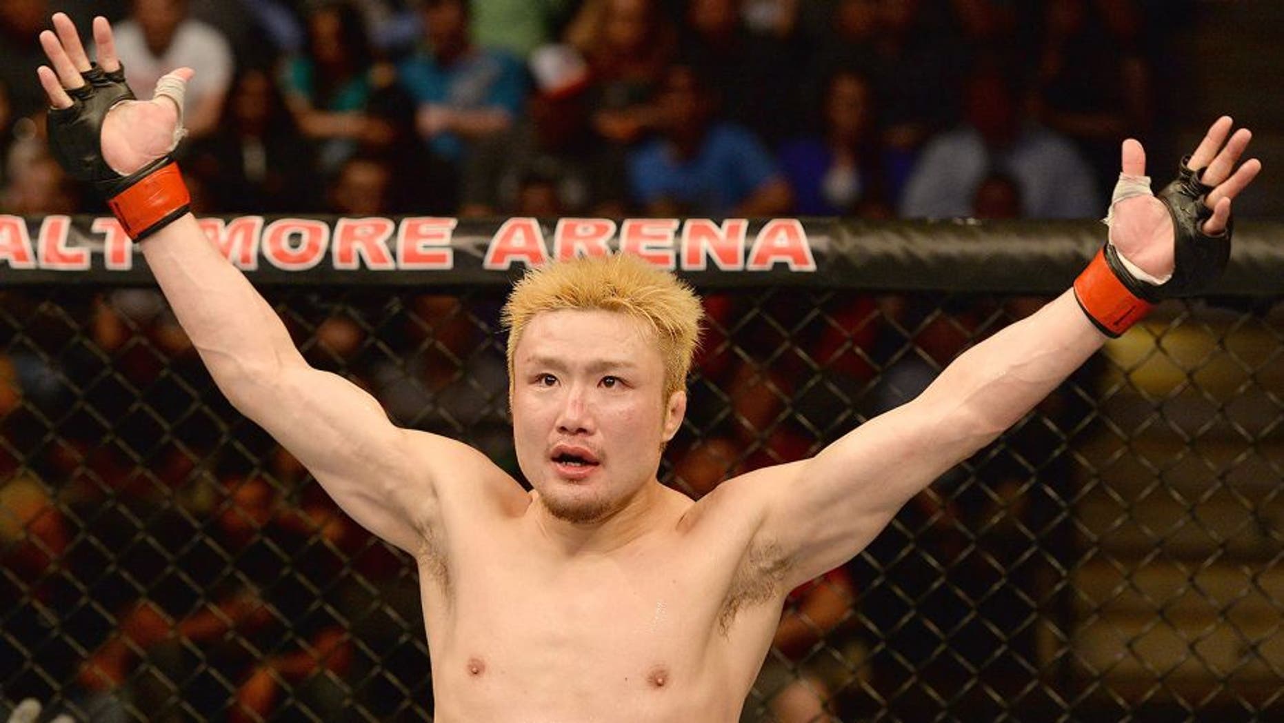 BALTIMORE, MD - APRIL 26: Takanori Gomi reacts to the crowd's applause before the third round of his lightweight bout against Isaac Vallie-Flagg during the UFC 172 event at the Baltimore Arena on April 26, 2014 in Baltimore, Maryland. (Photo by Patrick Smith/Zuffa LLC/Zuffa LLC via Getty Images)