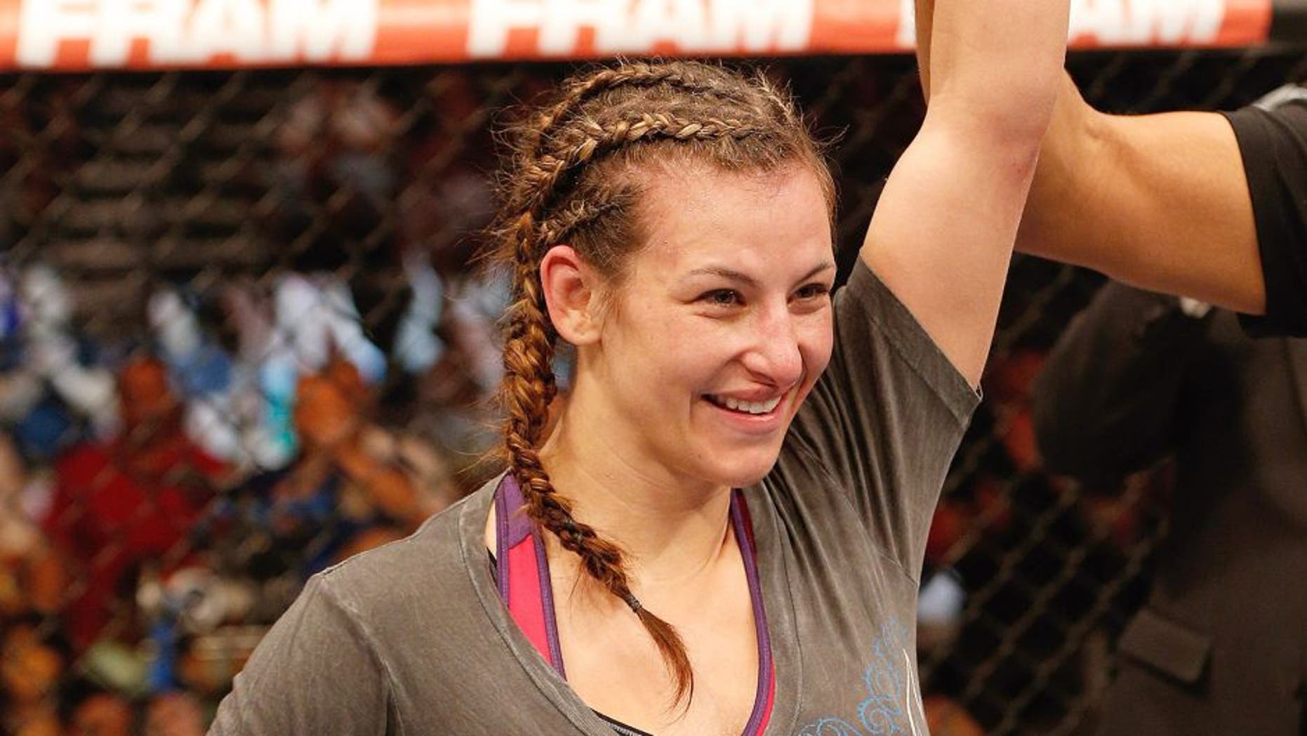 ORLANDO, FL - APRIL 19: Miesha Tate reacts after her decision victory over Liz Carmouche in their women's bantamweight bout during the FOX UFC Saturday event at the Amway Center on April 19, 2014 in Orlando, Florida. (Photo by Josh Hedges/Zuffa LLC/Zuffa LLC via Getty Images)