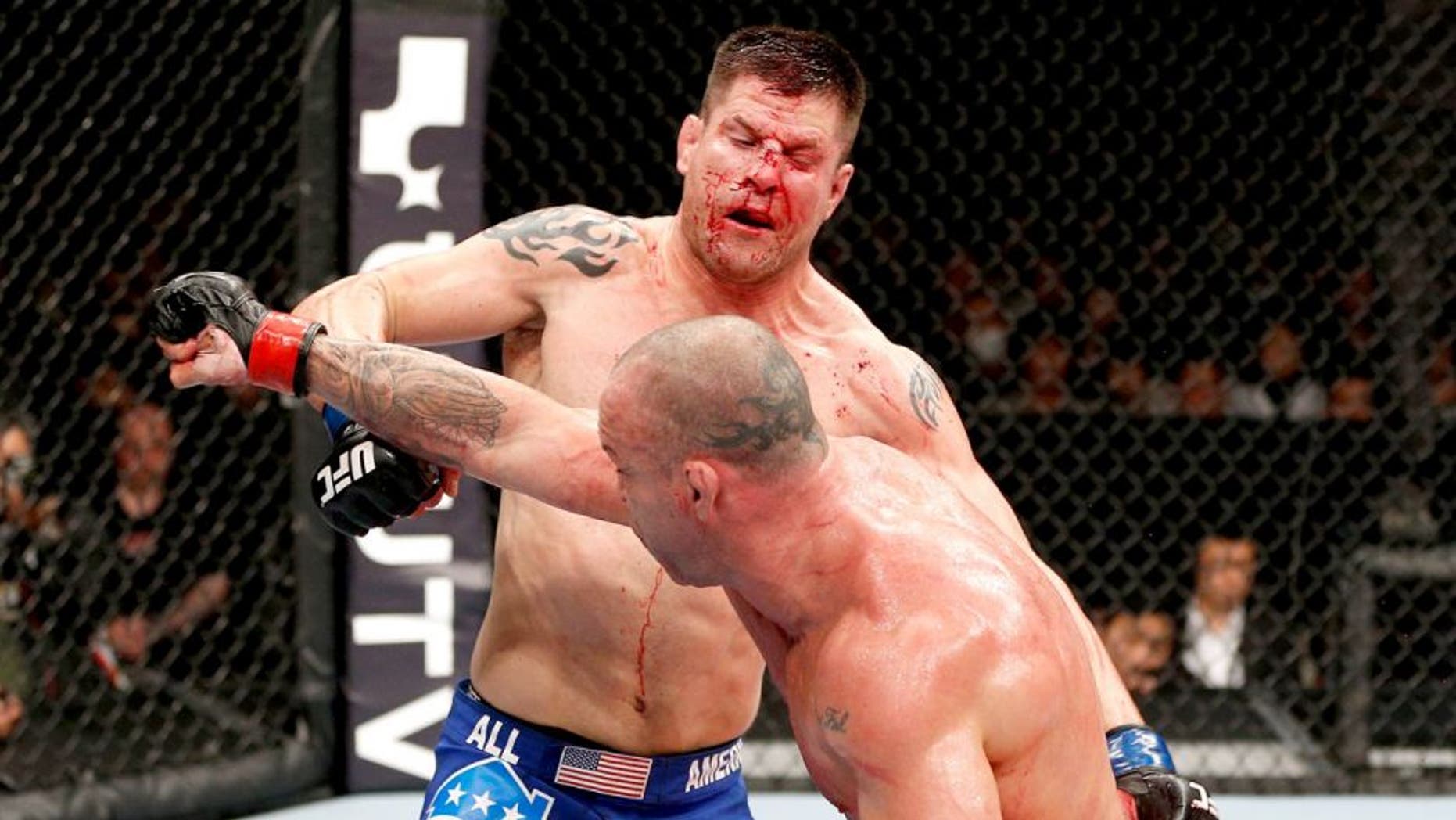 SAITAMA, JAPAN - MARCH 03: (R-L) Wanderlei Silva punches Brian Stann in their light heavyweight fight during the UFC on FUEL TV event at Saitama Super Arena on March 3, 2013 in Saitama, Japan. (Photo by Josh Hedges/Zuffa LLC/Zuffa LLC via Getty Images)