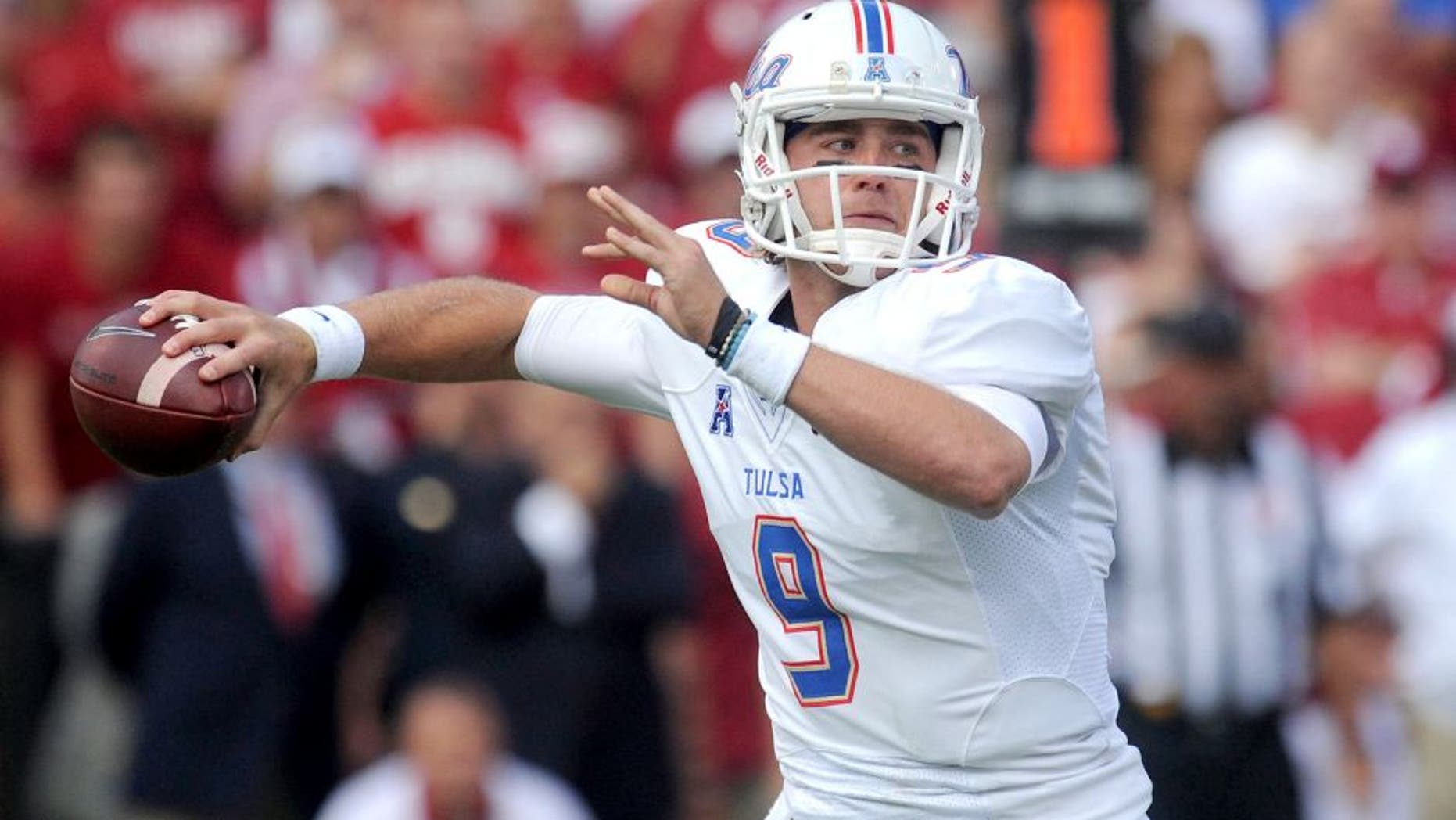 Sep 19, 2015; Norman, OK, USA; Tulsa Golden Hurricane quarterback Dane Evans (9) passes the ball against the Oklahoma Sooners in the fist quarter at Gaylord Family - Oklahoma Memorial Stadium. Mandatory Credit: Mark D. Smith-USA TODAY Sports