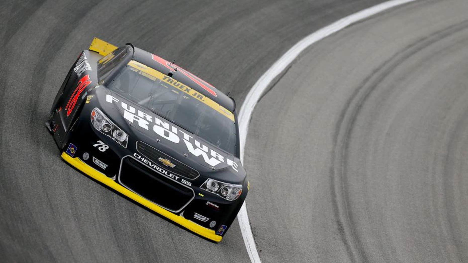 JOLIET, IL - SEPTEMBER 18: Martin Truex Jr, driver of the #78 Furniture Row/Visser Precision Chevrolet, drives during practice for the NASCAR Sprint Cup Series myAFibRisk.com 400 at Chicagoland Speedway on September 18, 2015 in Joliet, Illinois. (Photo by Jonathan Ferrey/Getty Images)