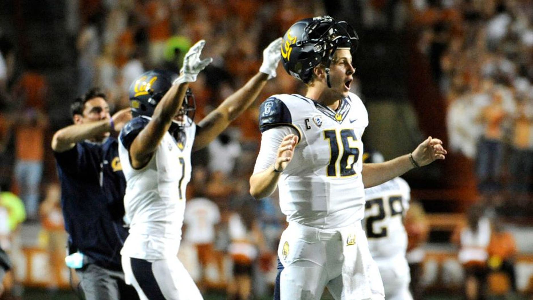 Sep 19, 2015; Austin, TX, USA; California Golden Bears quarterback Jared Goff (16) and wide receiver Bryce Treggs (1) react after the Texas Longhorns miss an extra point that would tie the game at 45 during the fourth quarter at Darrell K Royal-Texas Memorial Stadium. Cal beat Texas 45-44. Mandatory Credit: Brendan Maloney-USA TODAY Sports