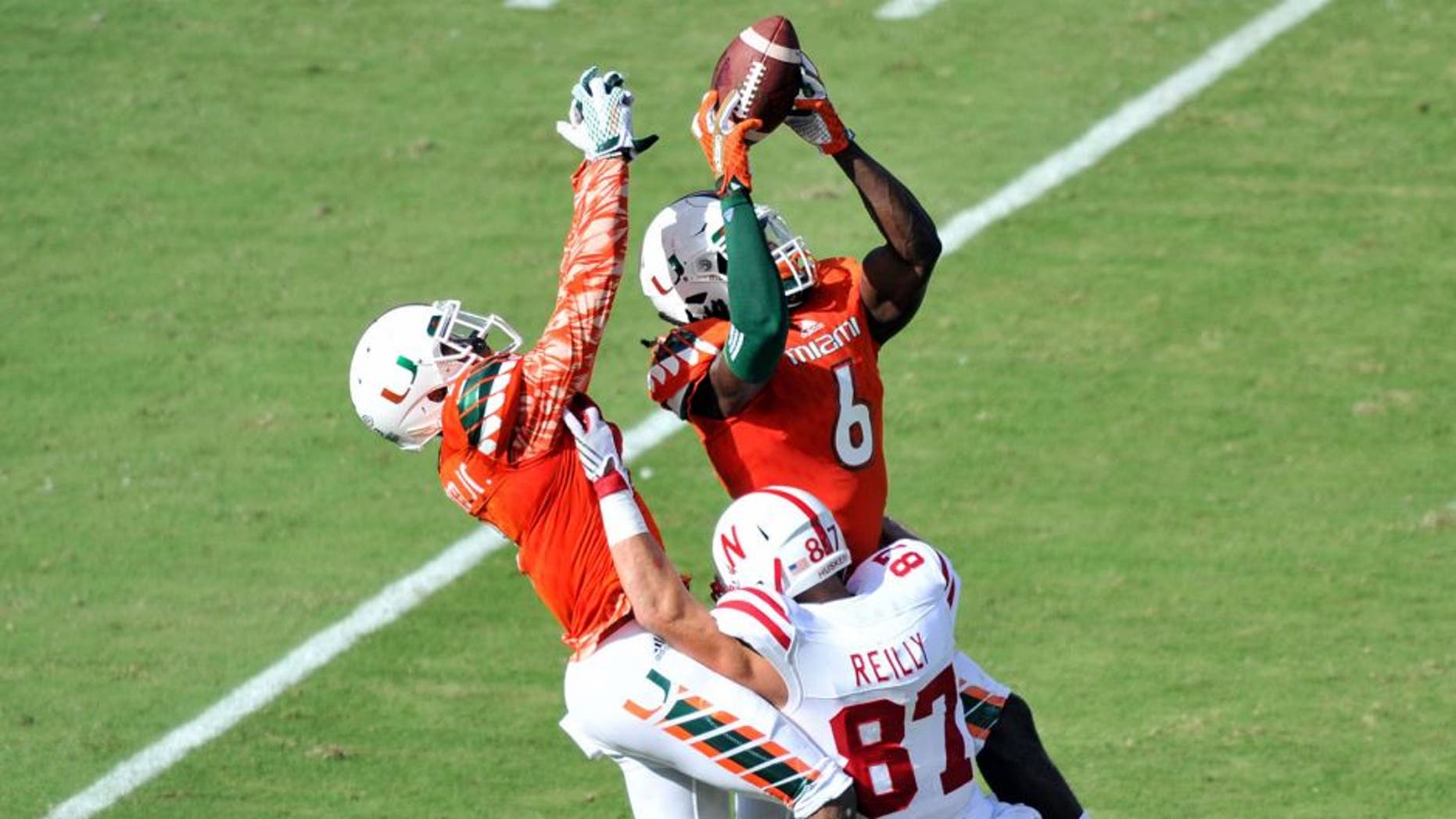 Sep 19, 2015; Miami Gardens, FL, USA; Miami Hurricanes defensive back Jamal Carter (6) is unable to make a catch that was intended for Nebraska Cornhuskers wide receiver Brandon Reilly (87) during the first half at Sun Life Stadium. Mandatory Credit: Steve Mitchell-USA TODAY Sports