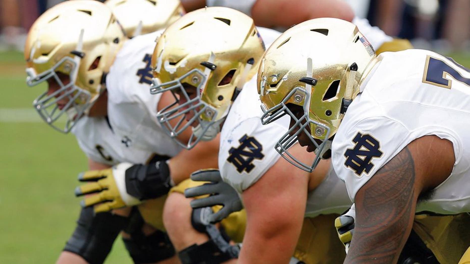 Sep 12, 2015; Charlottesville, VA, USA; The Notre Dame Fighting Irish offensive line lines up against the Virginia Cavaliers at Scott Stadium. Mandatory Credit: Geoff Burke-USA TODAY Sports