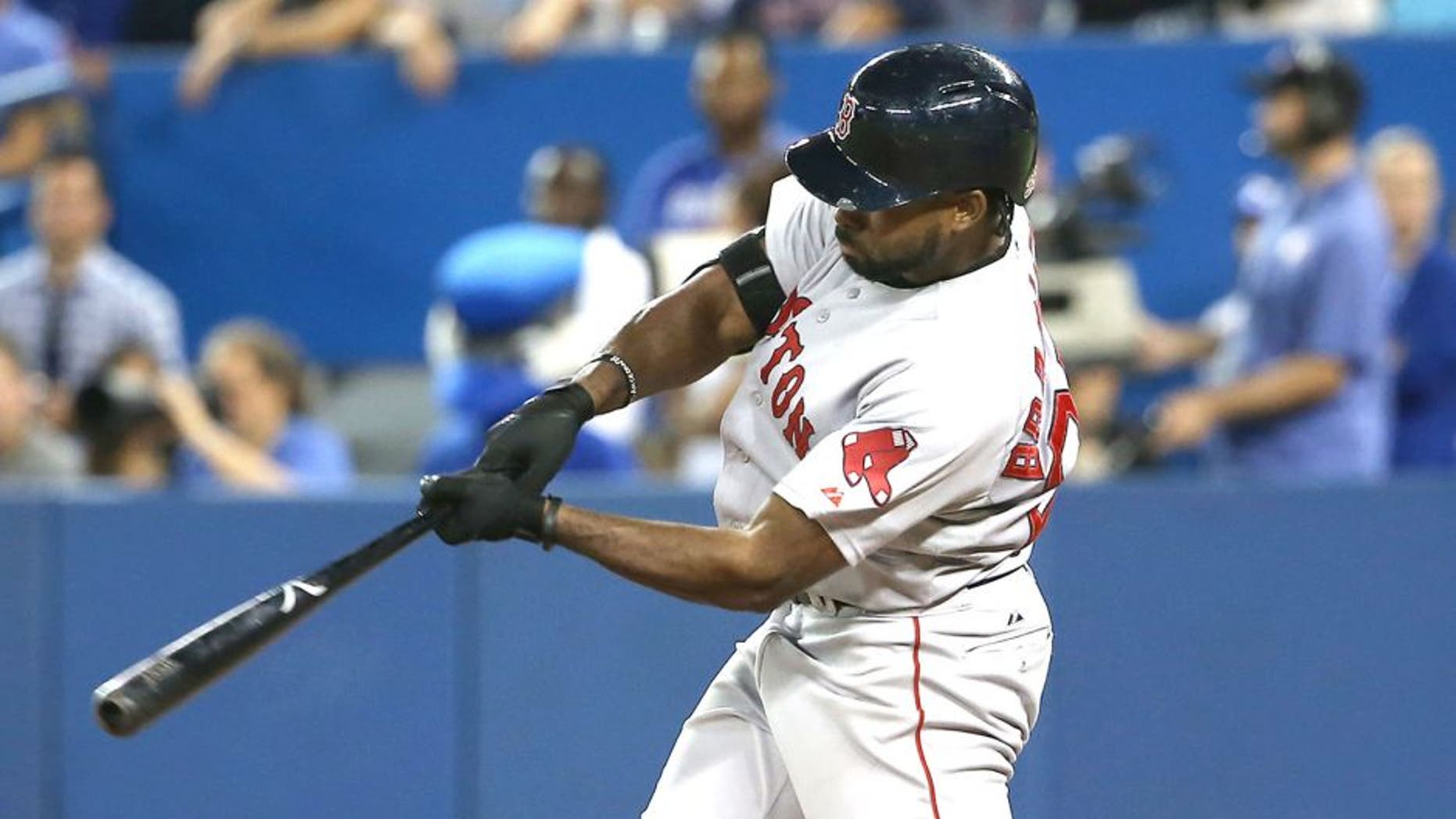 TORONTO, CANADA - SEPTEMBER 19: Jackie Bradley #25 of the Boston Red Sox hits a two-run home run in the ninth inning during MLB game action against the Toronto Blue Jays on September 19, 2015 at Rogers Centre in Toronto, Ontario, Canada. (Photo by Tom Szczerbowski/Getty Images)