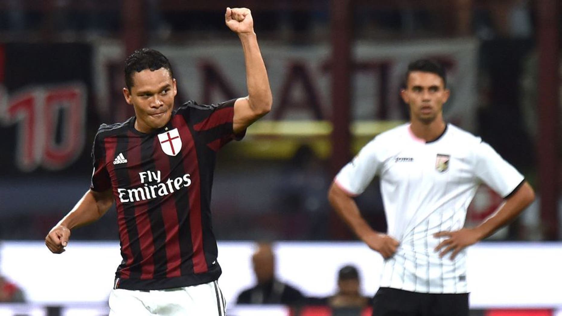 MILAN, ITALY - SEPTEMBER 19: Carlos Bacca (L) of Milan celebrates after scoring the opening goal during the Serie A match between AC Milan and US Citta di Palermo at Stadio Giuseppe Meazza on September 19, 2015 in Milan, Italy. (Photo by Tullio M. Puglia/Getty Images)